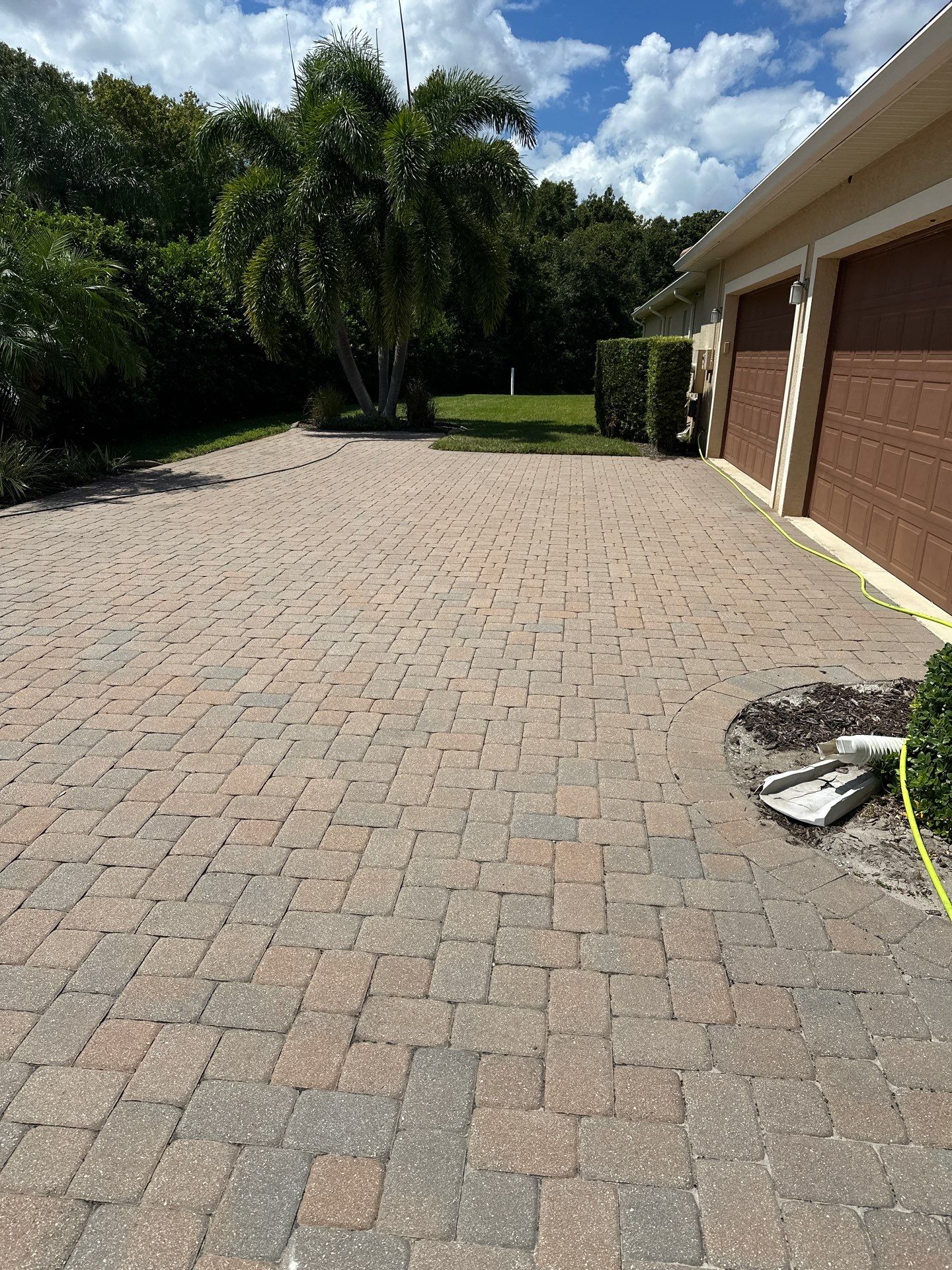 Paver Driveway, Entryway, Sidewalk, and Street Curbing Cleaning in Winding River Community, Bradenton, FL by Sunshine AquaWash