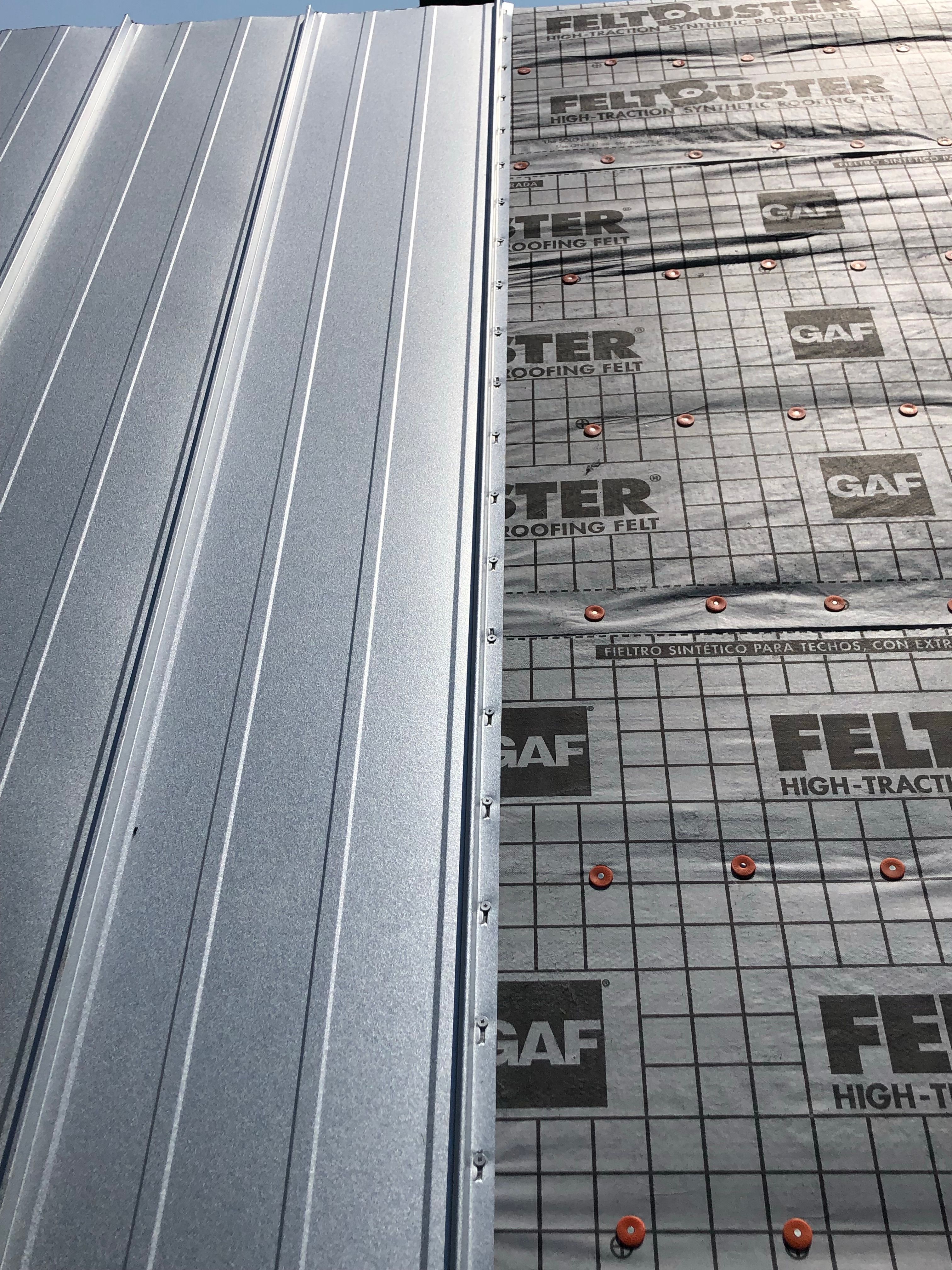 Residential Roofing Installation using Metal roofing by American Roofing & Construction LLC