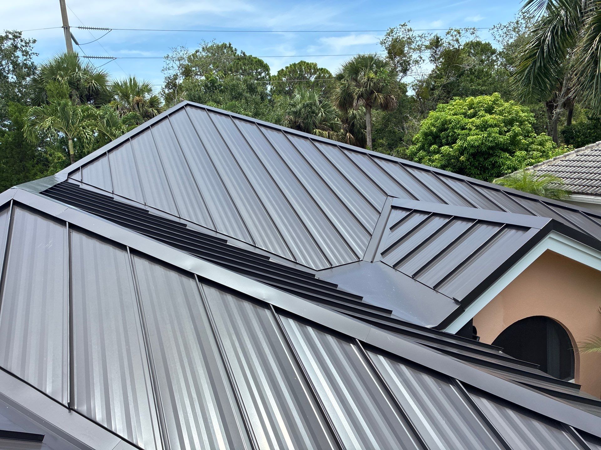 24ga 1.5" Mechanical Seam Dark Bronze by Total Roofing System The Metal Roof Experts
