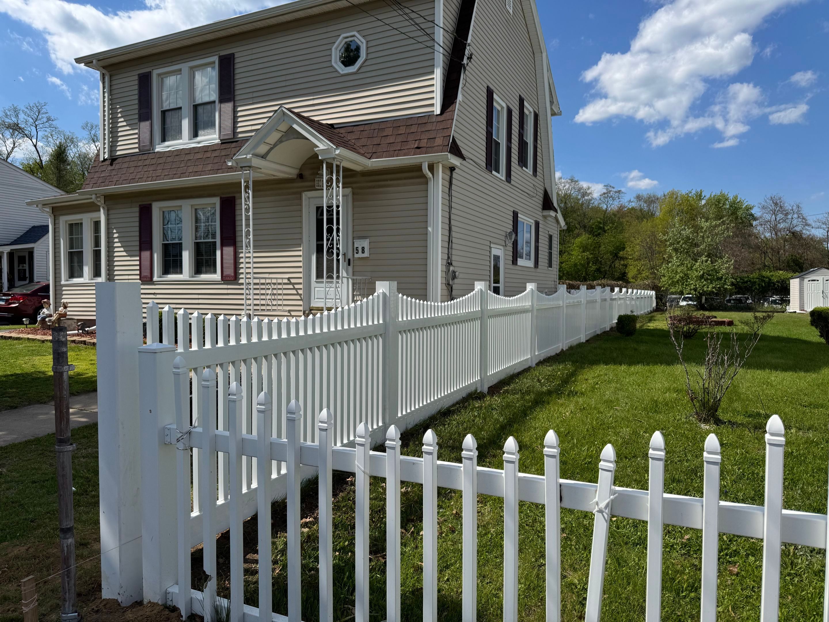 Fence replacement using White Vinyl picket with scalloped edge. by DiGiorgi Roofing and Siding Inc