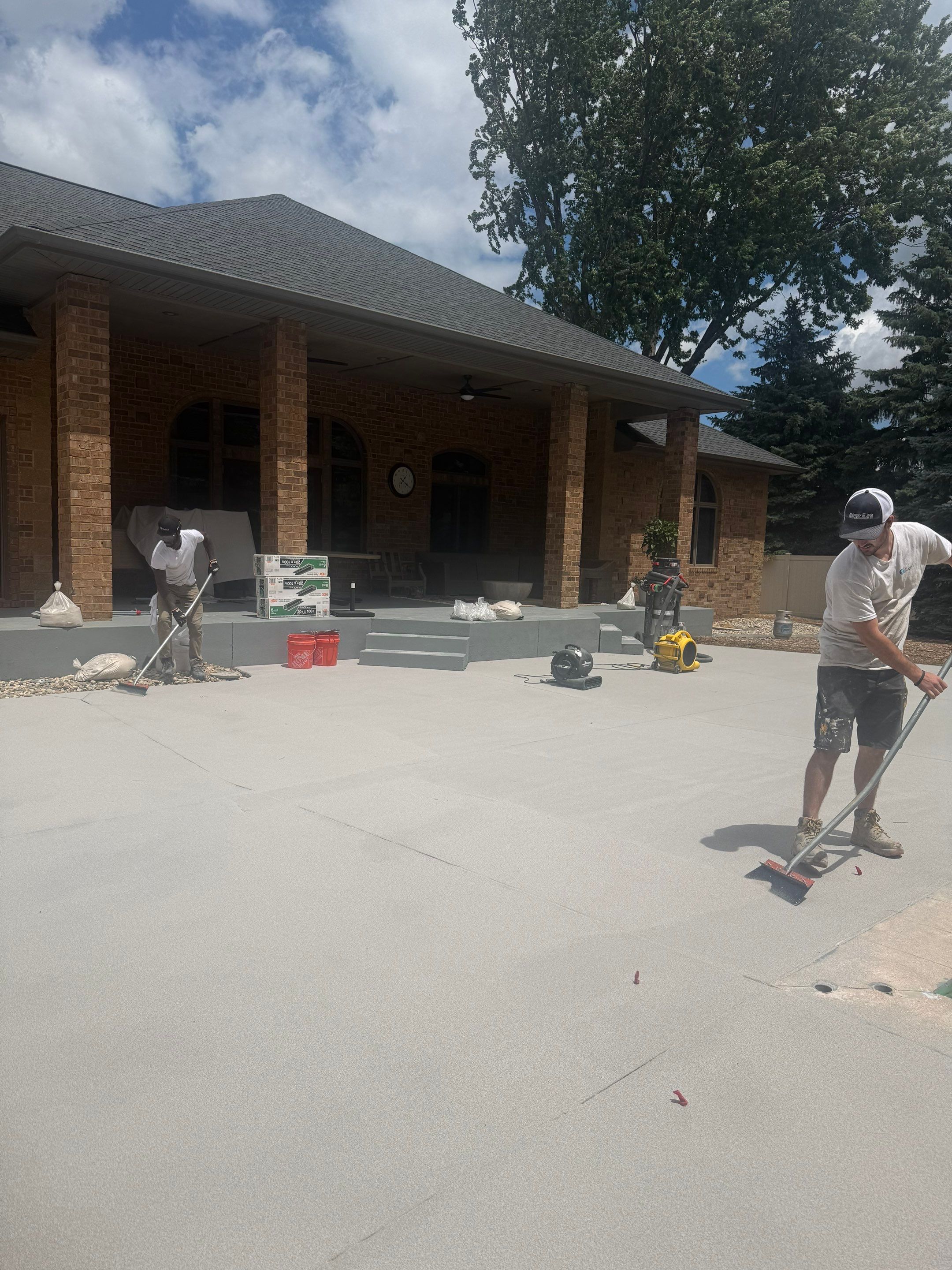 Decorative Concrete Pool Deck and Patio Resurfacing in Sioux Falls by Select Painting, Coatings & Garage Cabinets