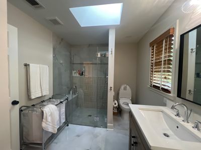 Modern Bathroom Remodeling Featuring Marble Tiles and Custom Cabinetry in Smyrna