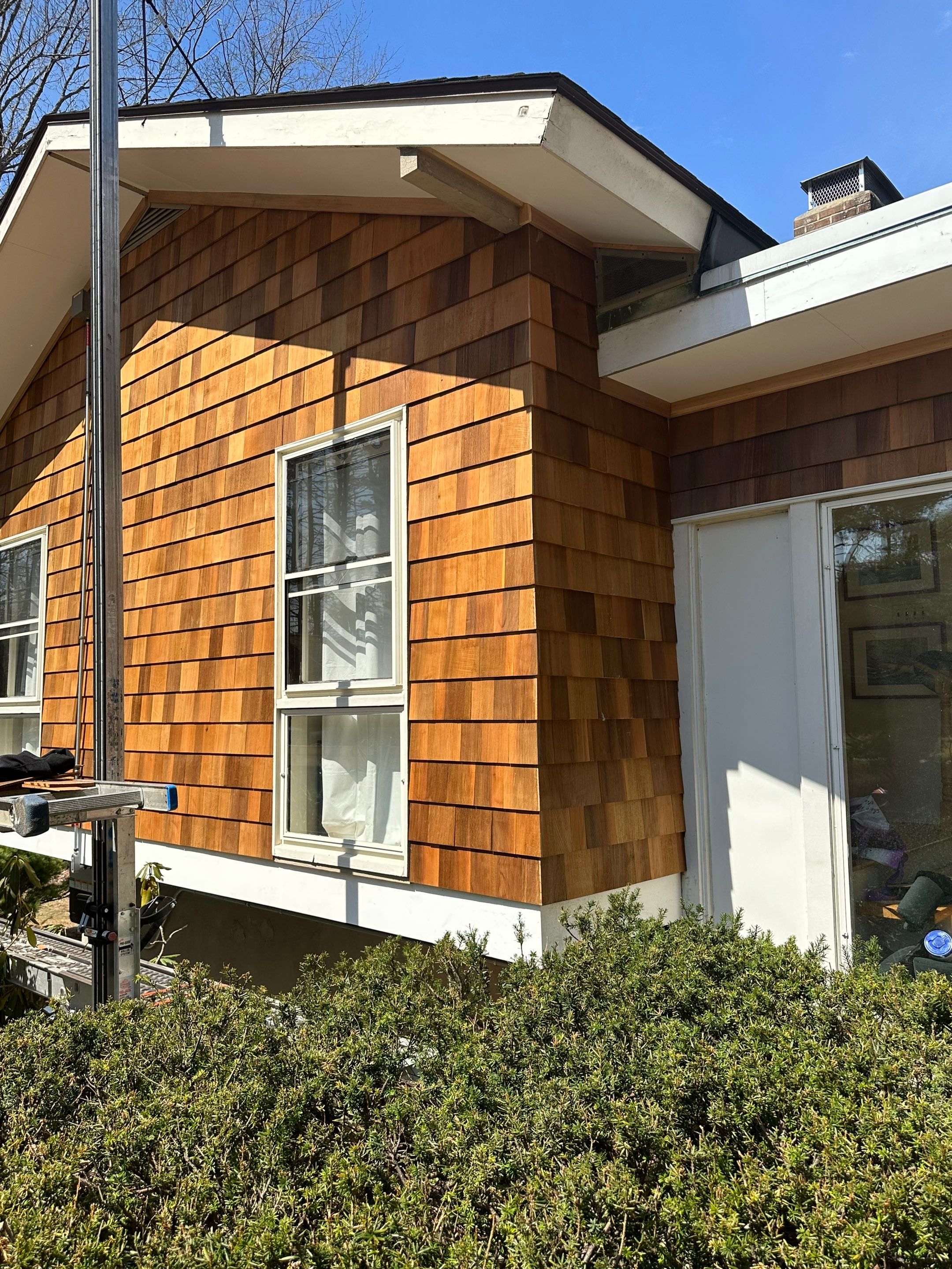 Siding Installation using Perfection Red Western Cedar Shingles  by Loyalty Exterior Solutions 