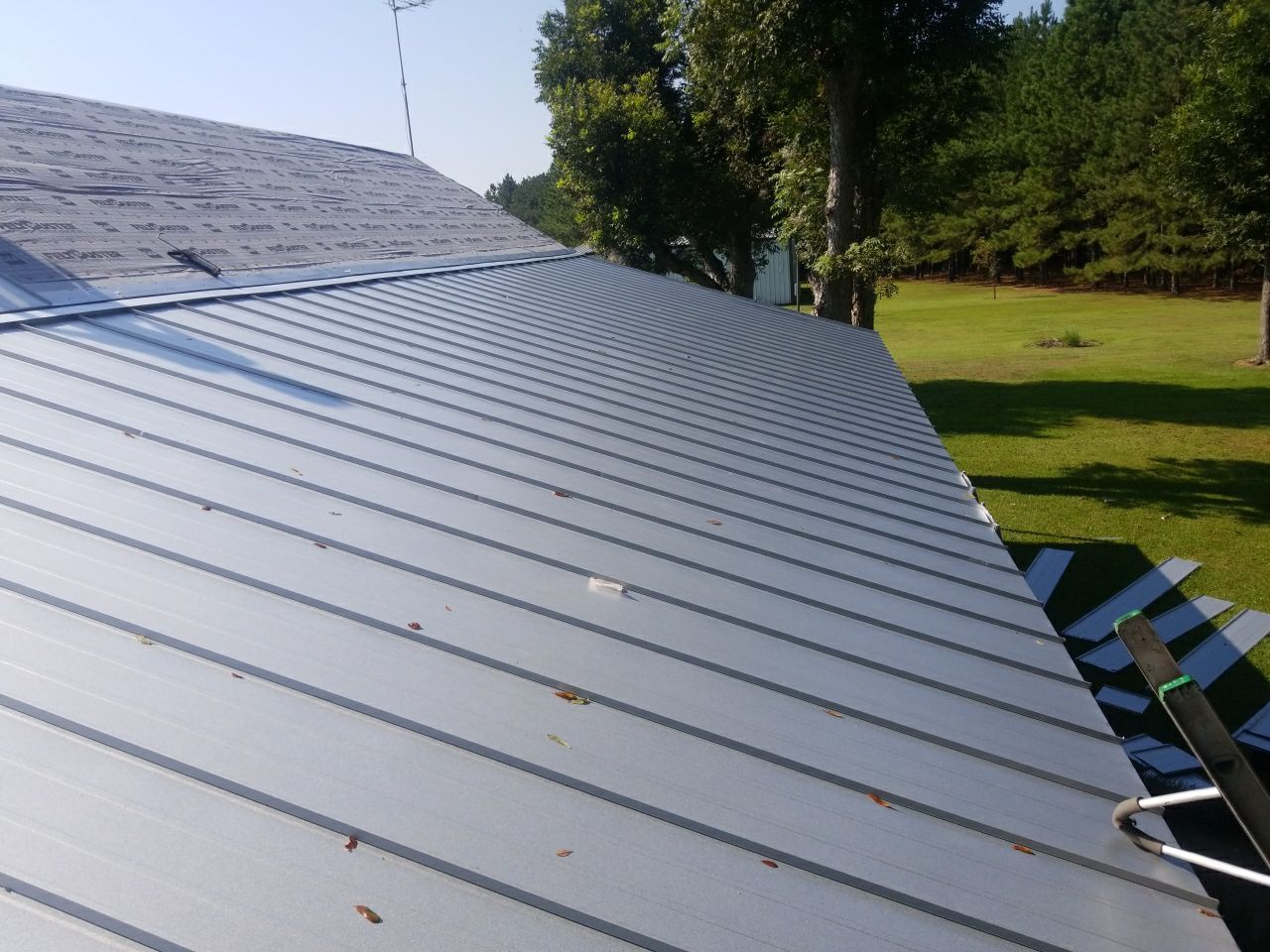 Residential Roofing Installation using Metal roofing by American Roofing & Construction LLC