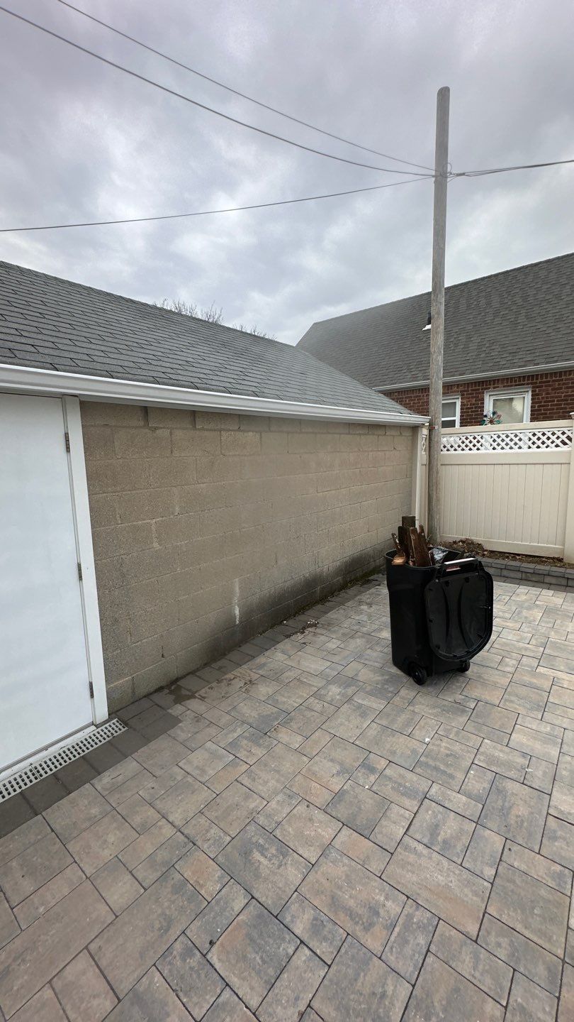 Queens Garage Fascia Rebuild + New 5" Seamless Gutter by Above All Gutters 