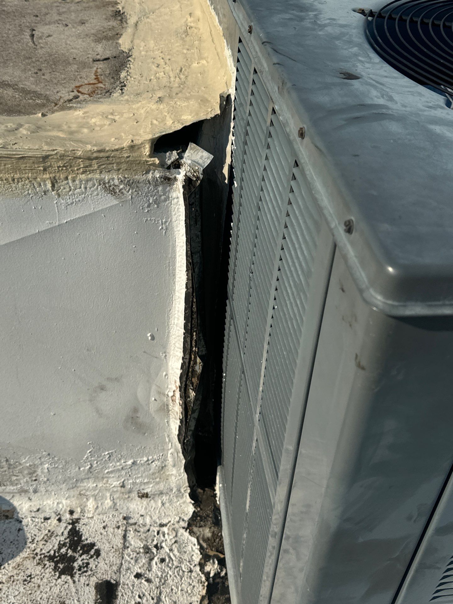 Waterproofing AC Curb covered courtyard on a flat Roof by Associates Roofing Unlimited