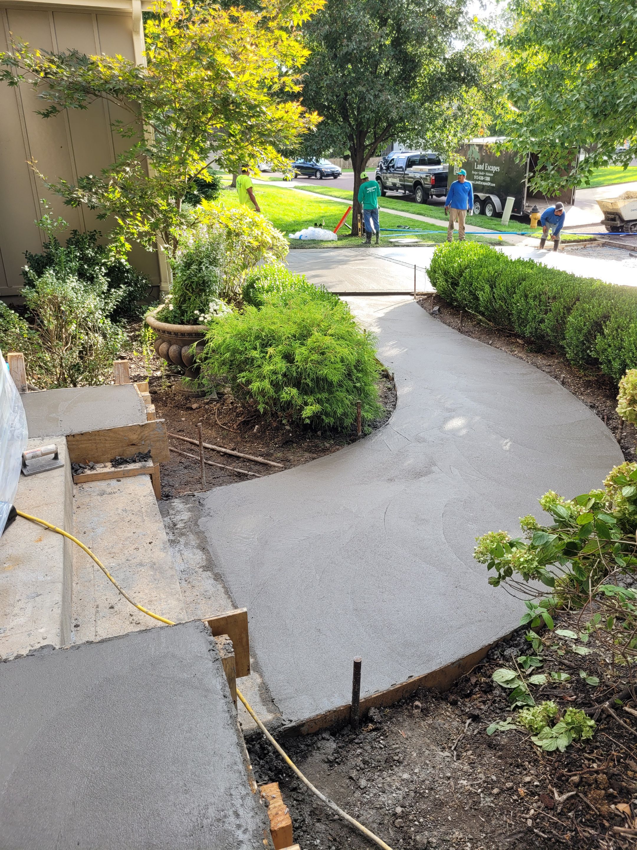 New Driveway and Sidewalk by LAND ESCAPES LLC