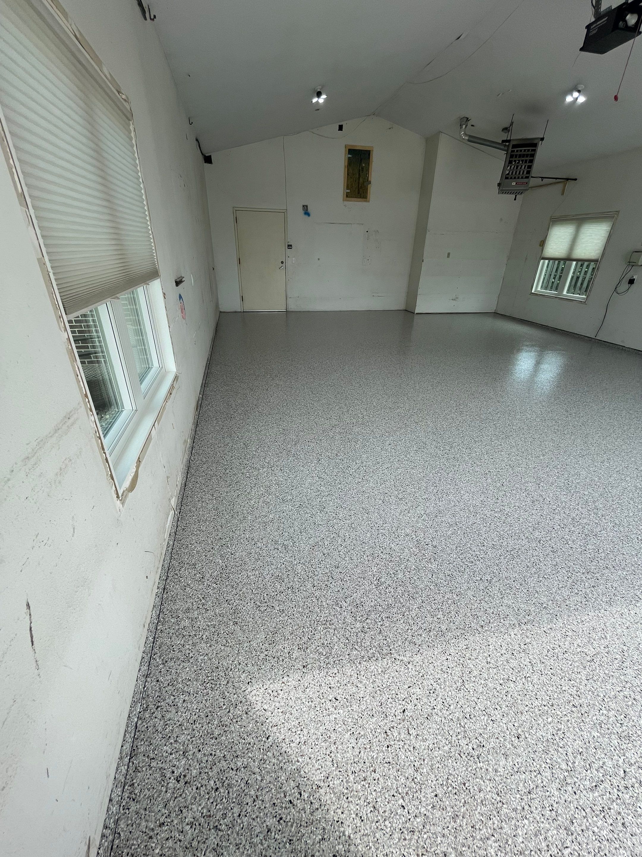 Coyote Flake Concrete Coating for Sioux Falls Garage by Select Painting, Coatings & Garage Cabinets