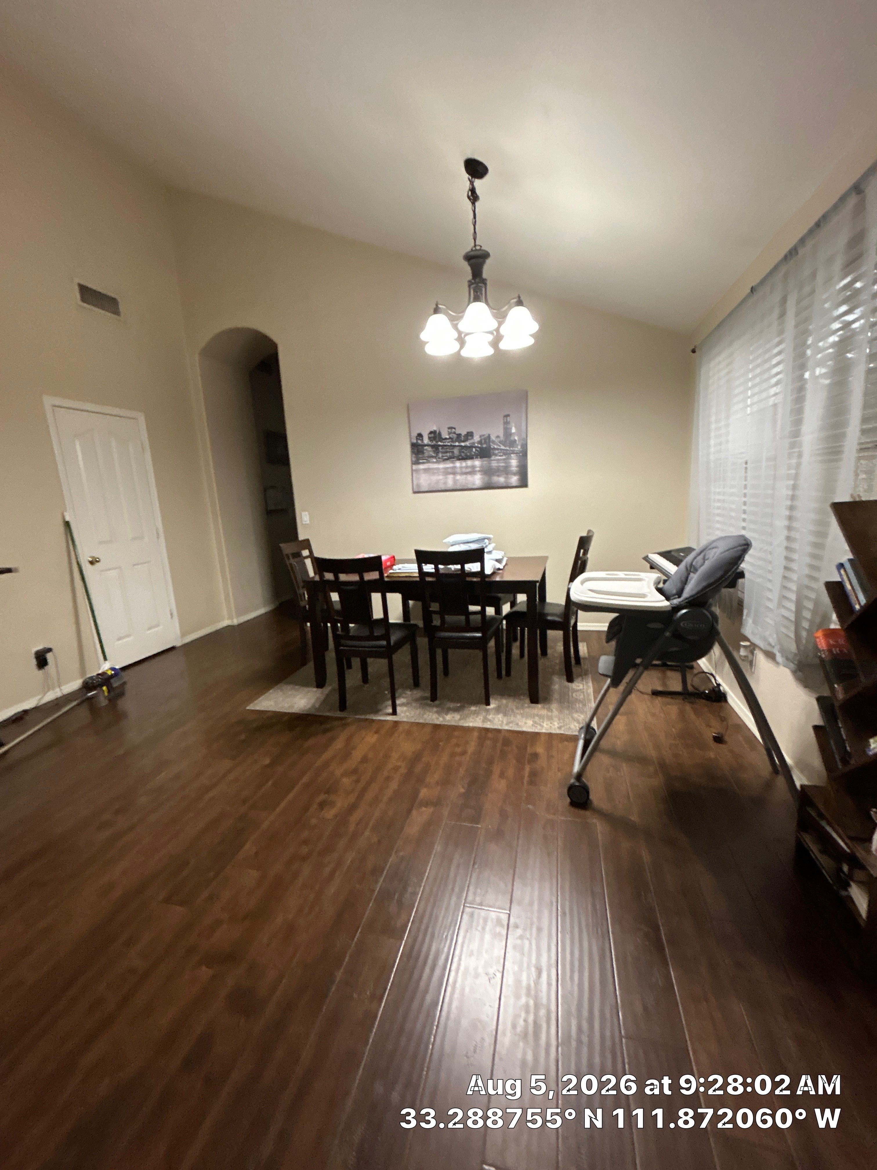 Modern Dining Room Renovation With Dark Wood Flooring in Chandler by CompanyCam Sales Demo