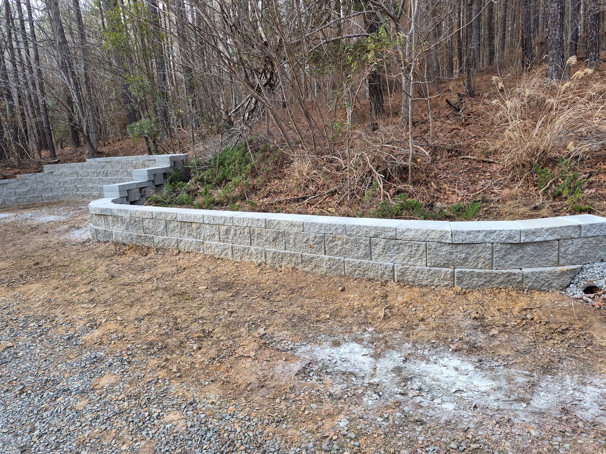 Pittsboro Outdoor Living Transformation – Retaining Wall, Paver Patio & Elevated Deck by Elite Remodeling and Design LLC