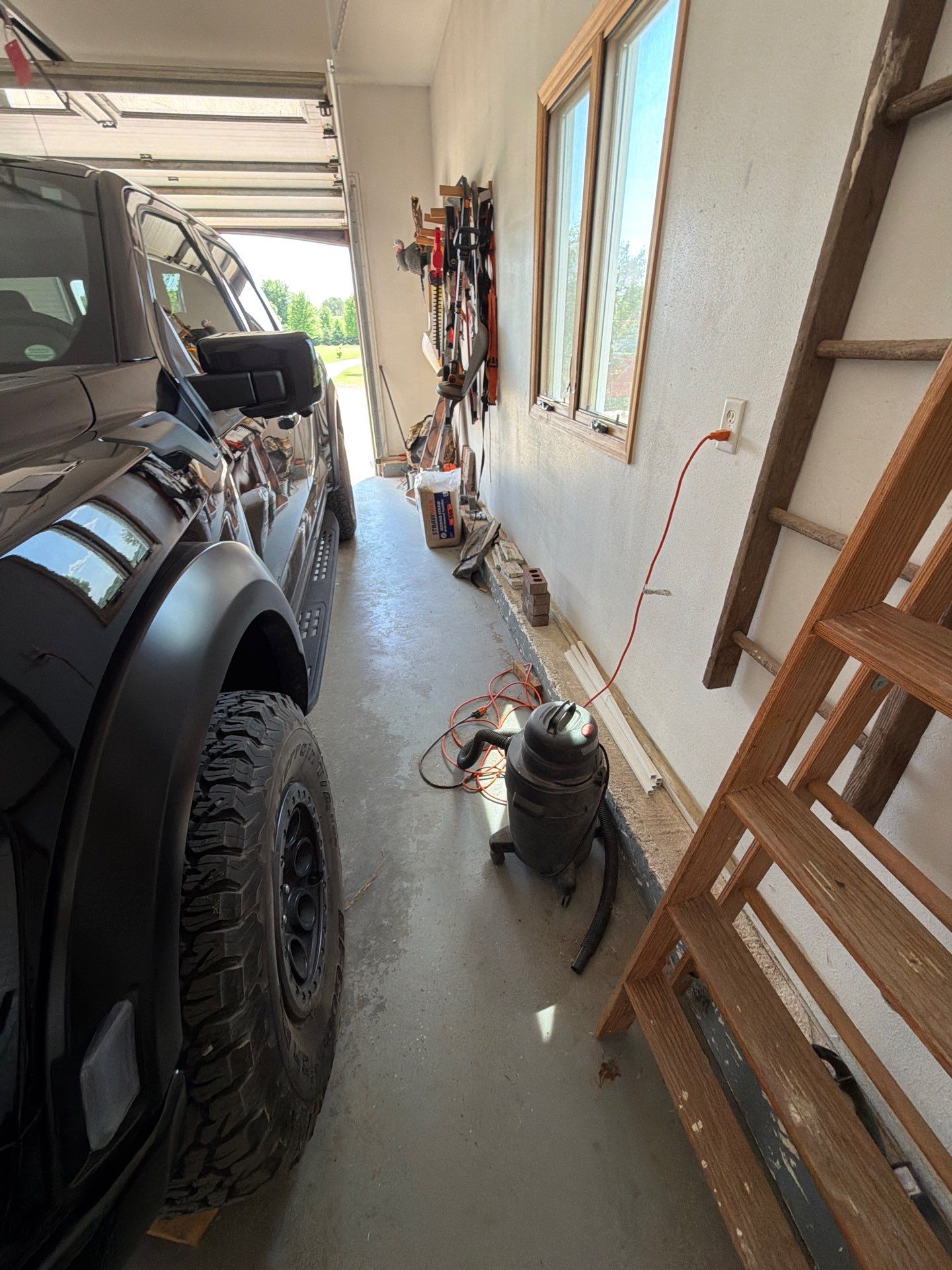 Feather Grey Garage Floor Coating Installation in Valley Springs by Select Painting, Coatings & Garage Cabinets