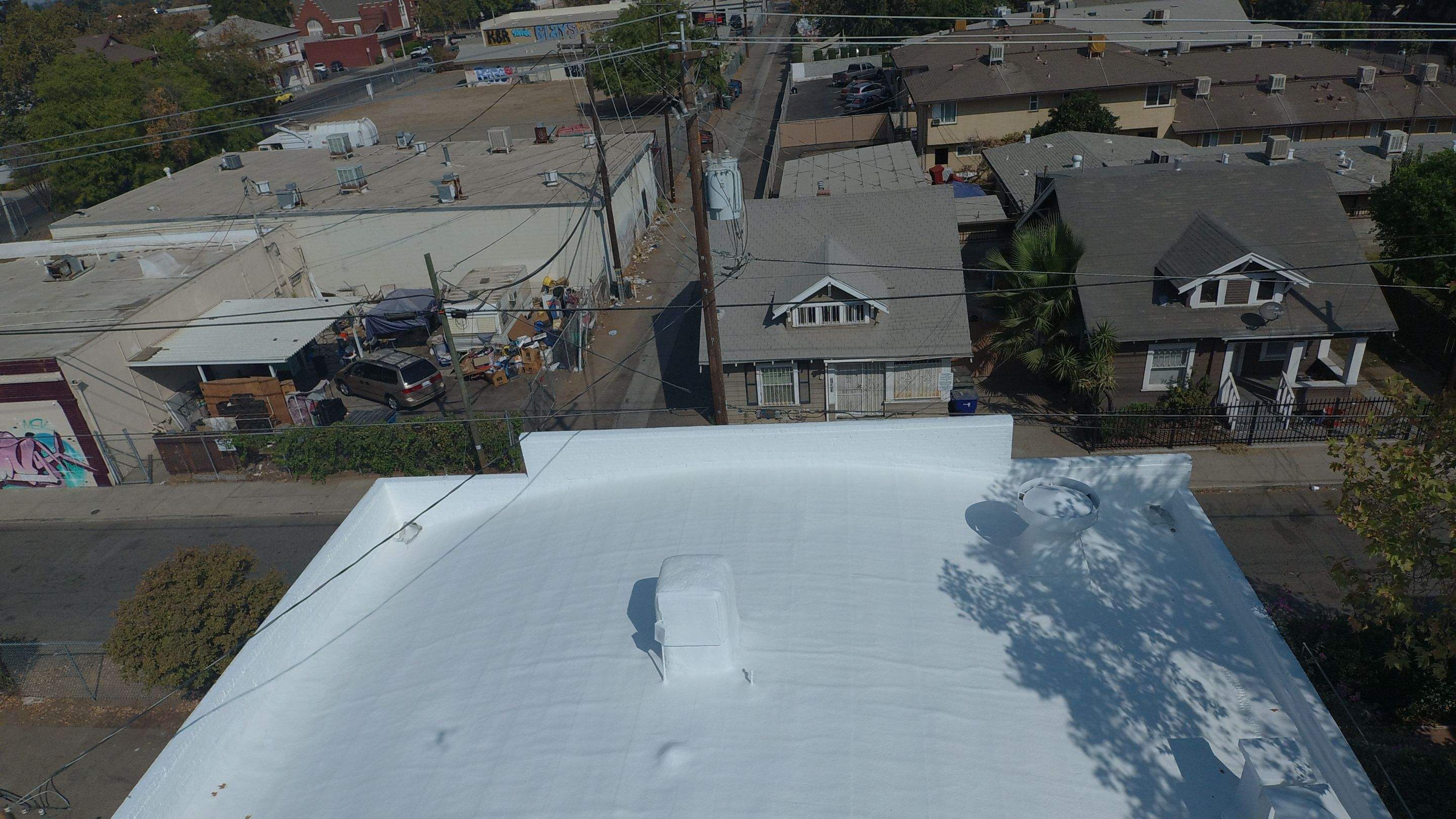 Polyurethane foam roof refurbish and recoating by Straight Edge Roofing Inc