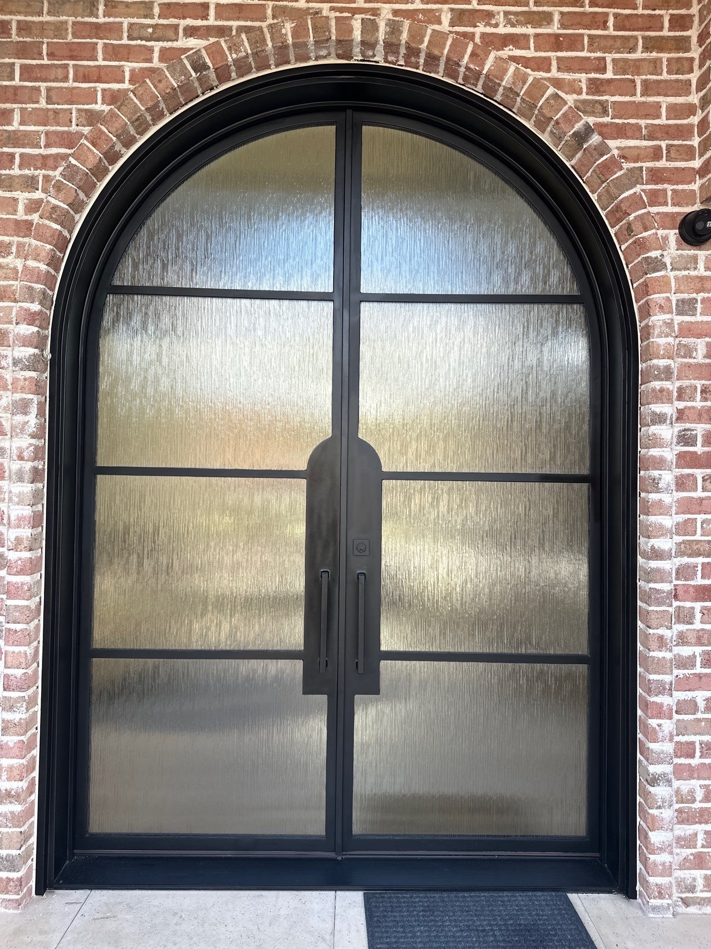 Custom Arched Metal Entry Door Installation in Plano by Solara Custom Living