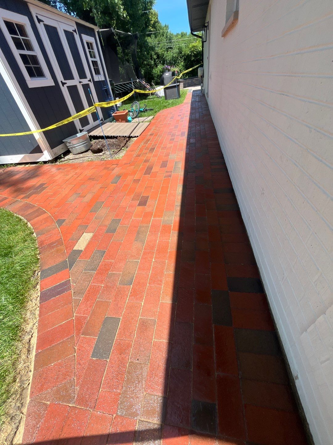 Brick paver repair, cleaning and sealing by Northern Power Washing LLC.