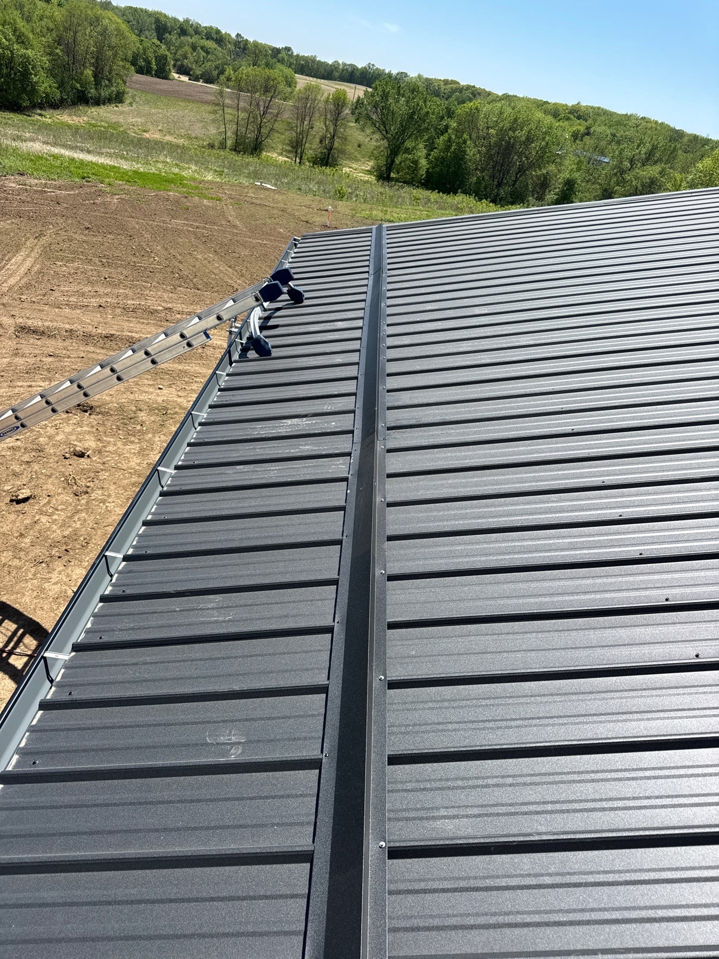 Black Gutter Installation + Snow Guards on Shouse by Next Level Seamless Gutters / Exteriors Inc.