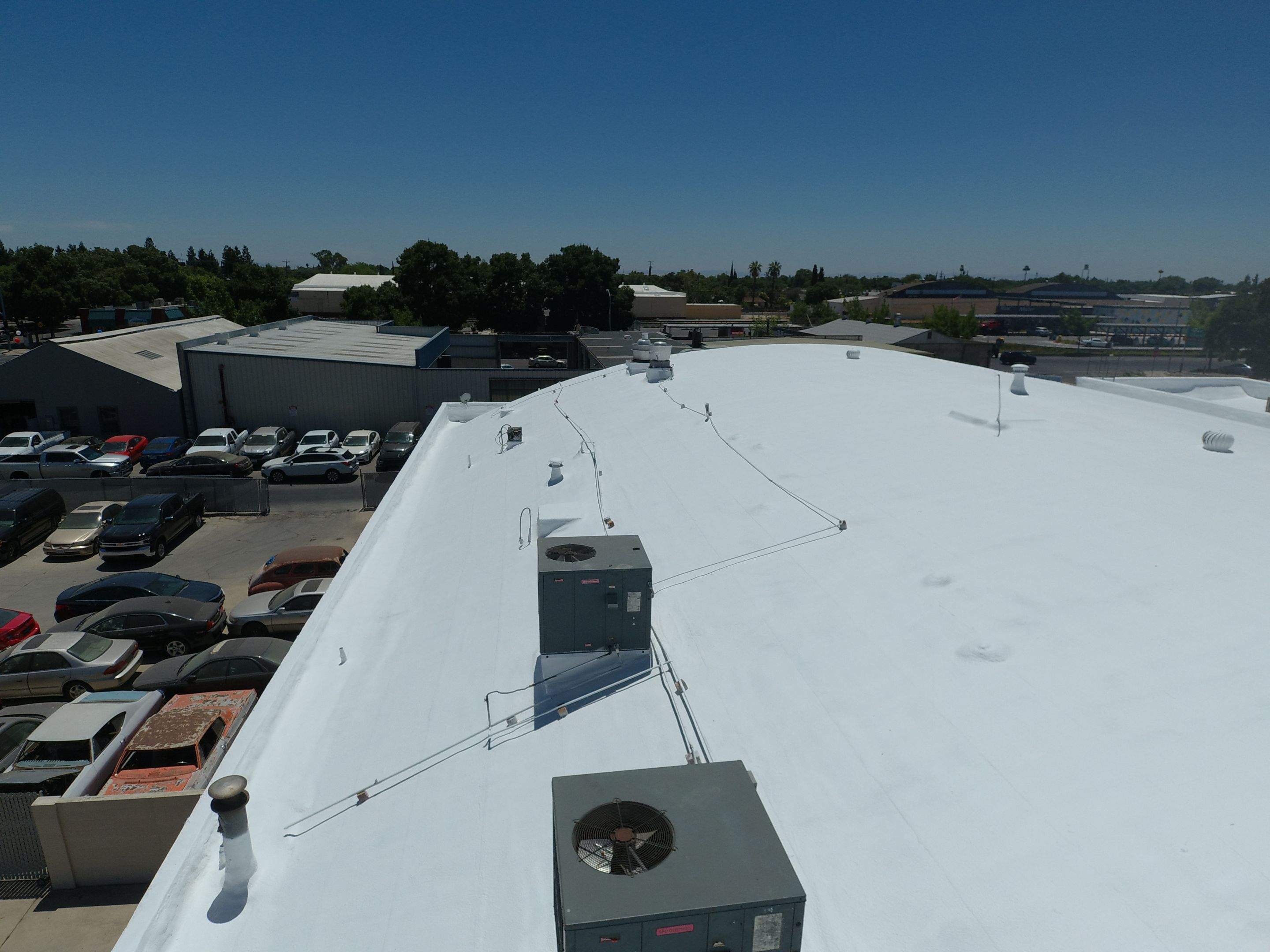 Spray foam and coatings using Conklin Benchmark/PUMA XL coatings and spray foam by Straight Edge Roofing Inc