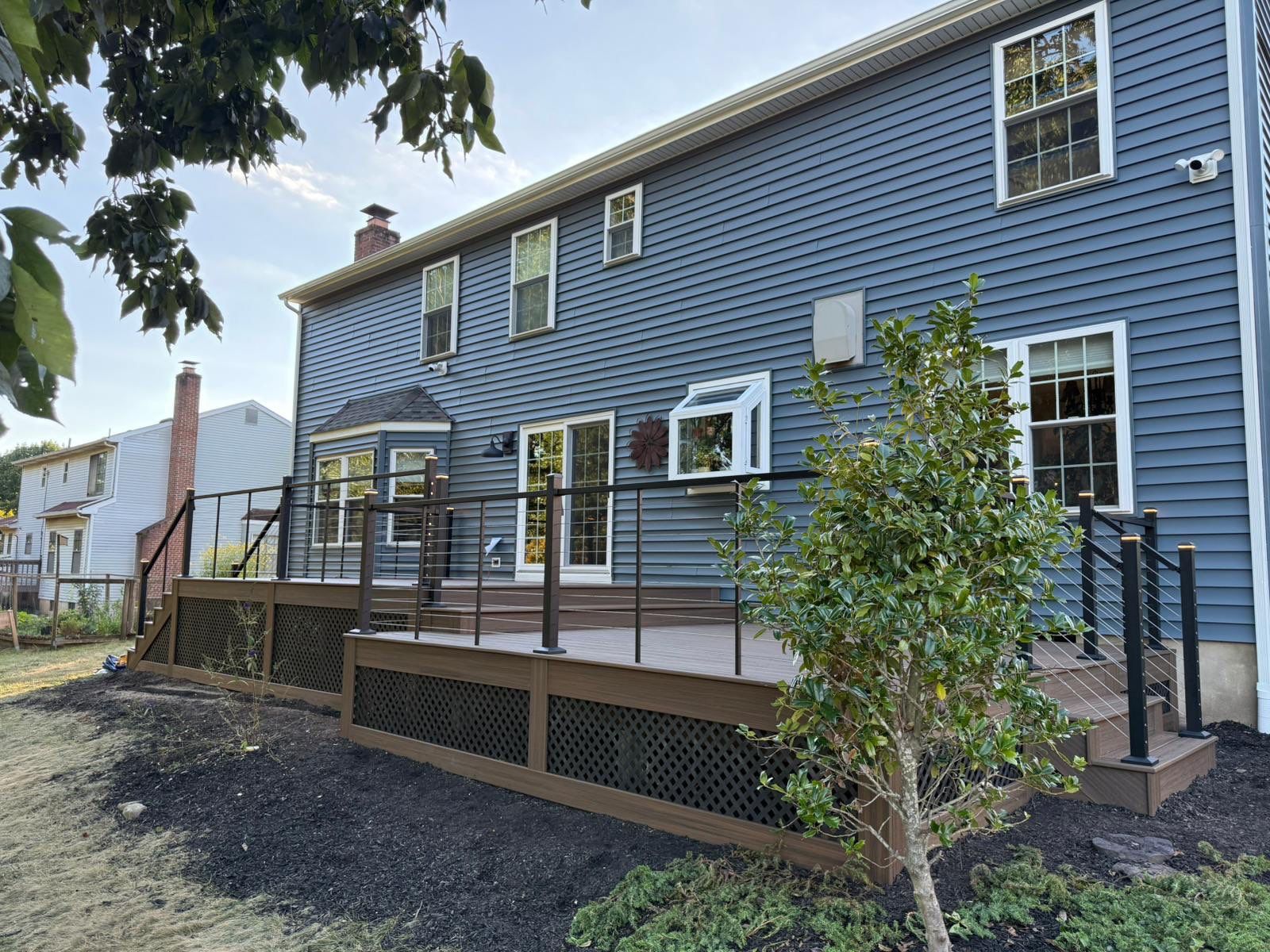 Deck resurface with Trex and cable rails by deck guardian