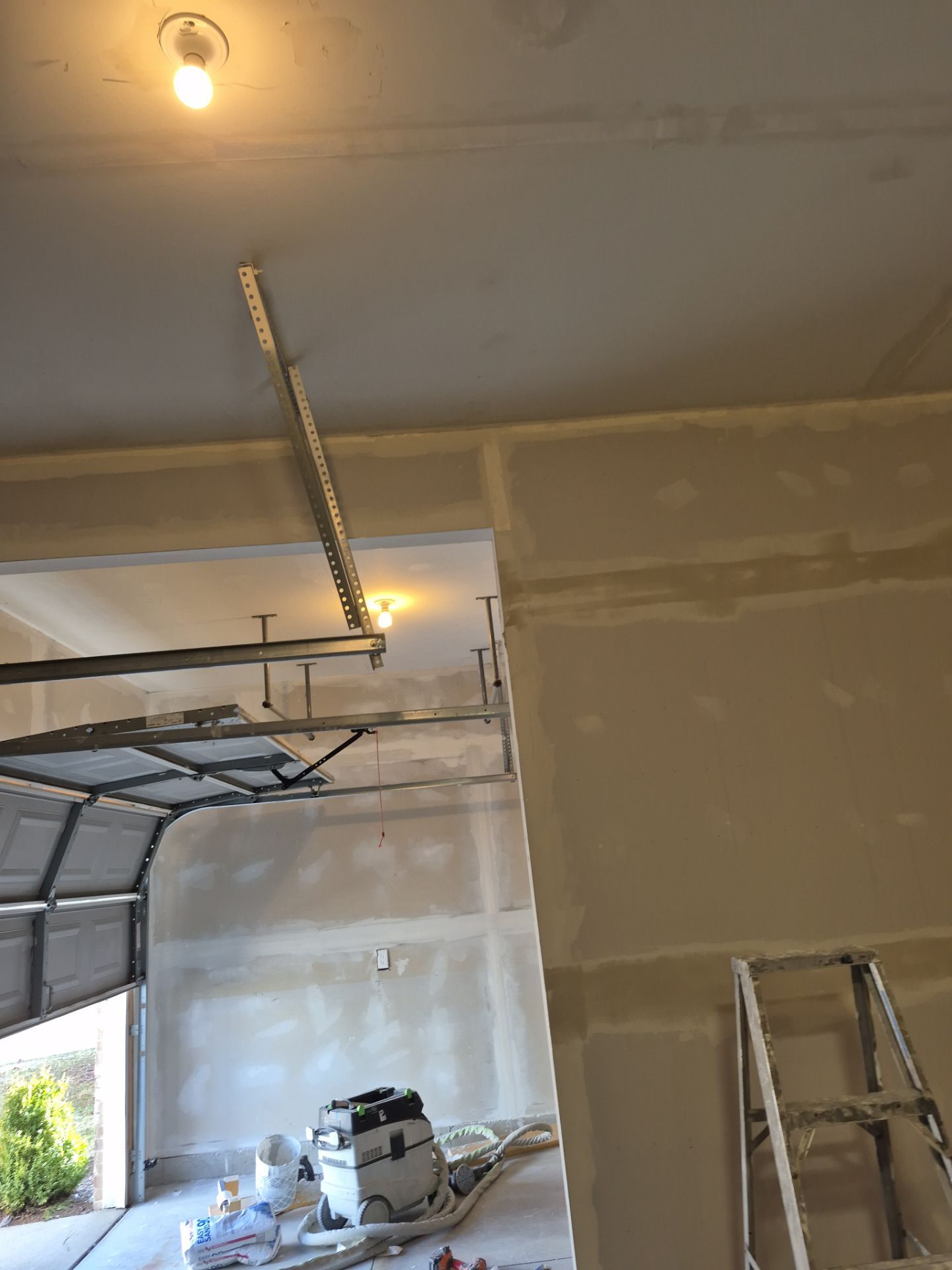 Custom Epoxy Flake Floor and Garage Wall Renovation in Ada by Gordon Painting