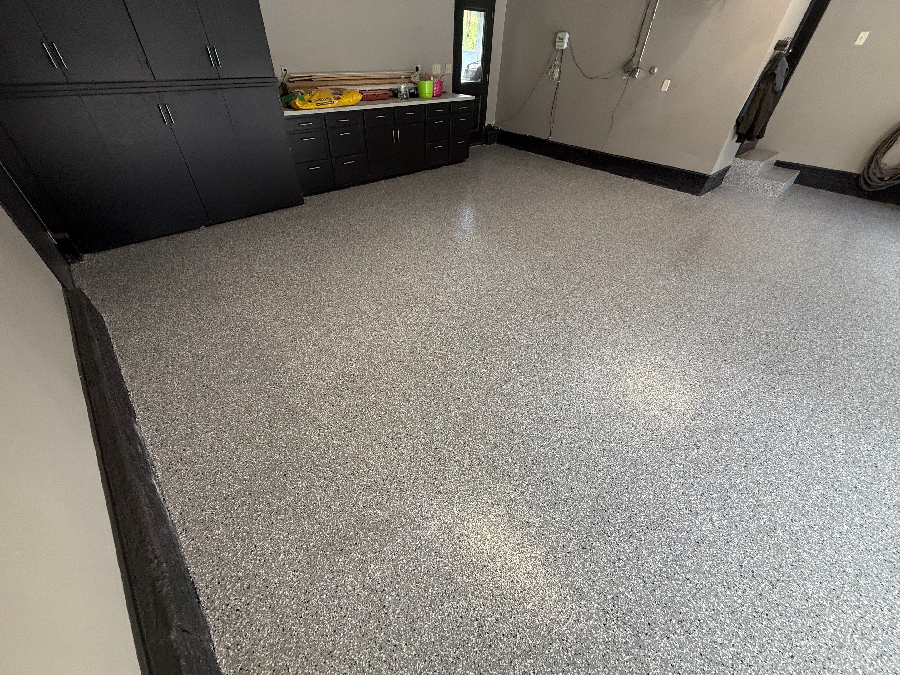 Garage Floor and Textured Pool Deck Coating in Sioux Falls by Select Painting, Coatings & Garage Cabinets