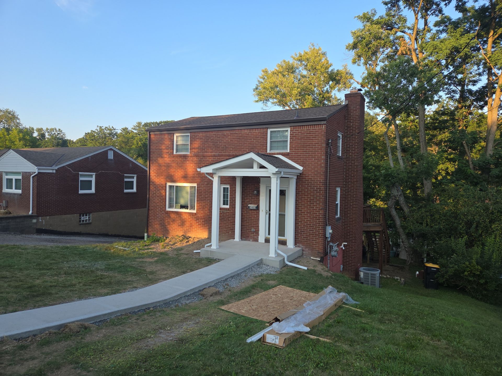 Concret and roof build  by Cousins Roofing Siding & Decks