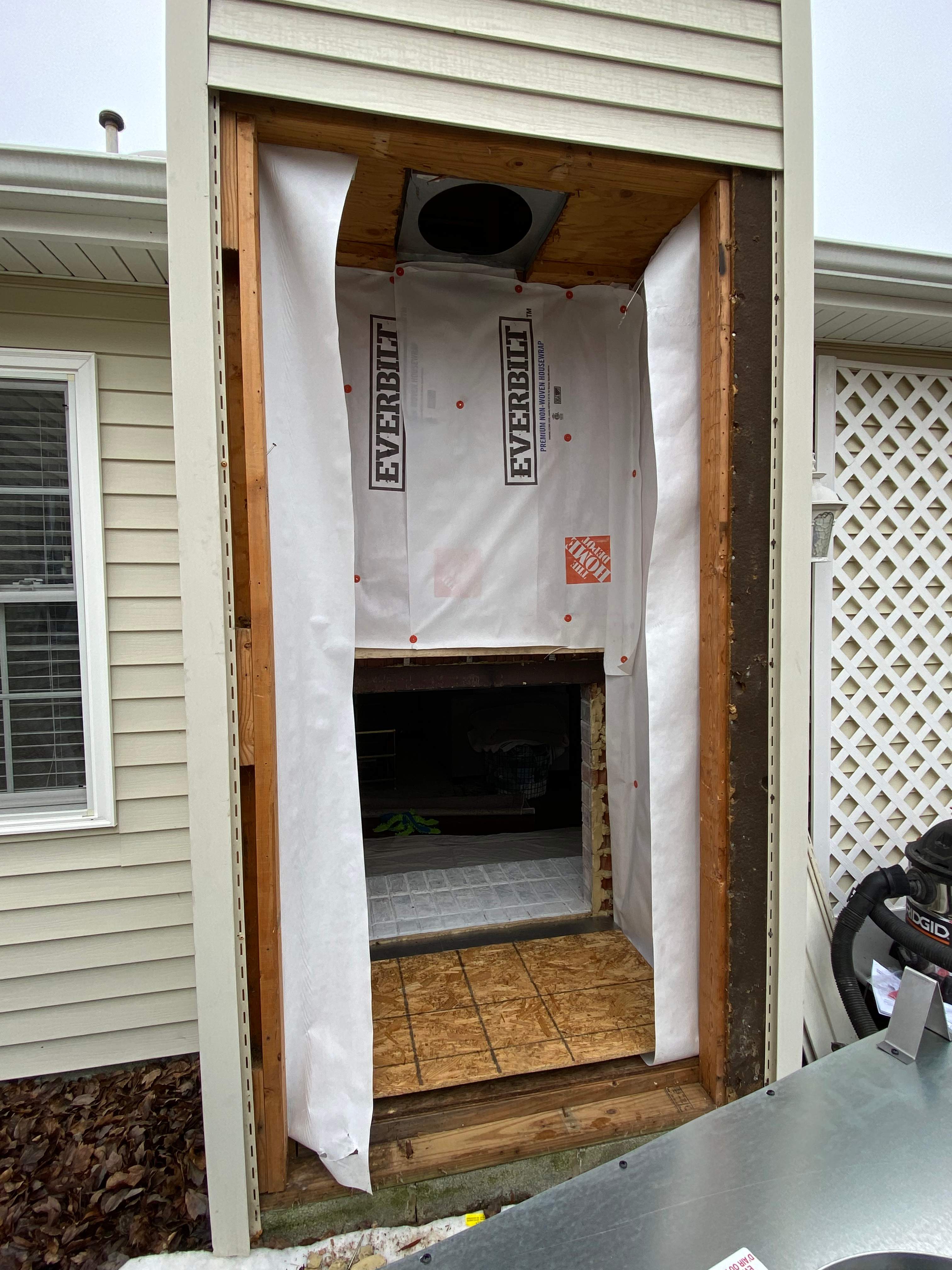 Wood Prefab Fireplace Replacement in Virginia Beach by Premier Chimney and Roofing