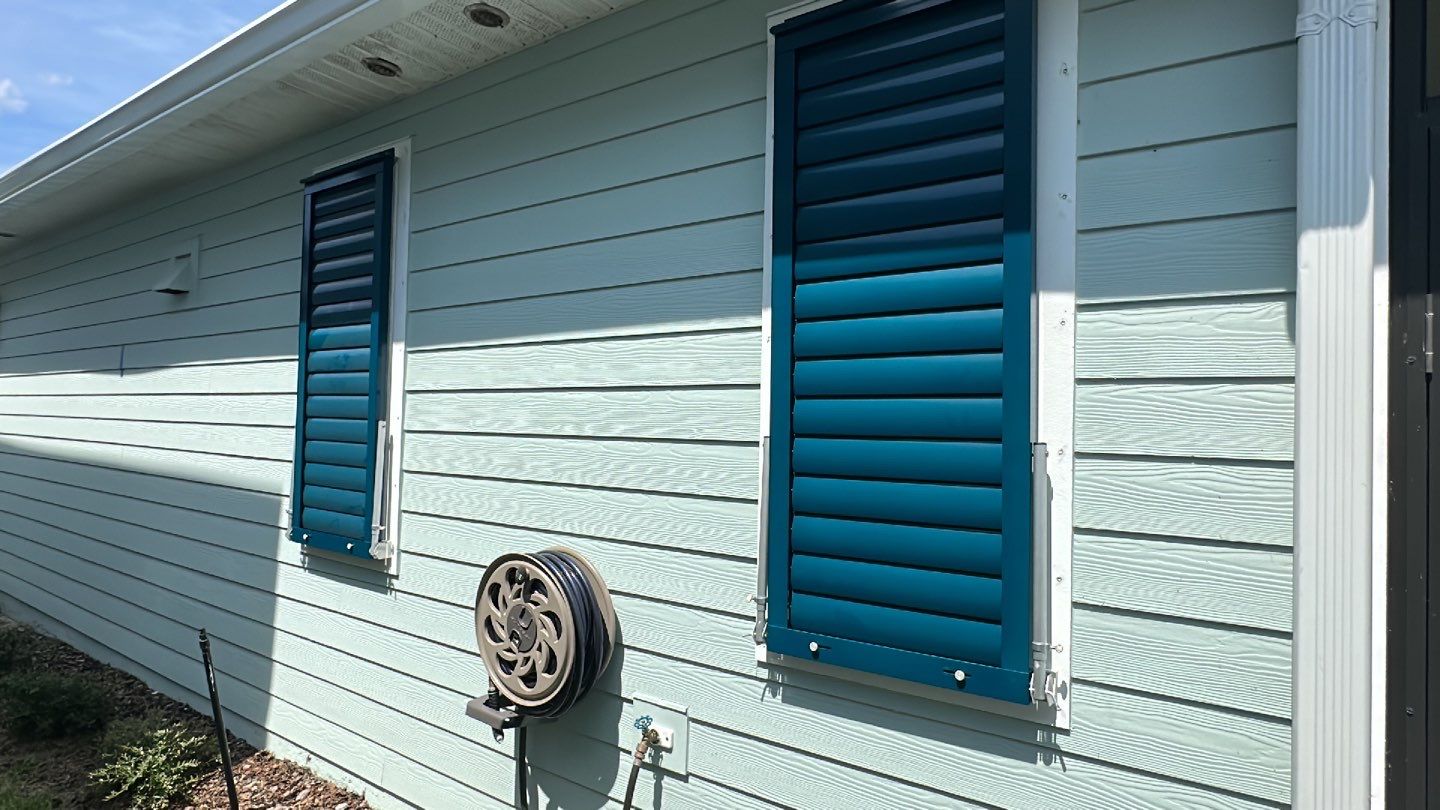 Hurricane Rated Bahama Shutters in Ocean Blue by Smart Guard Shutters