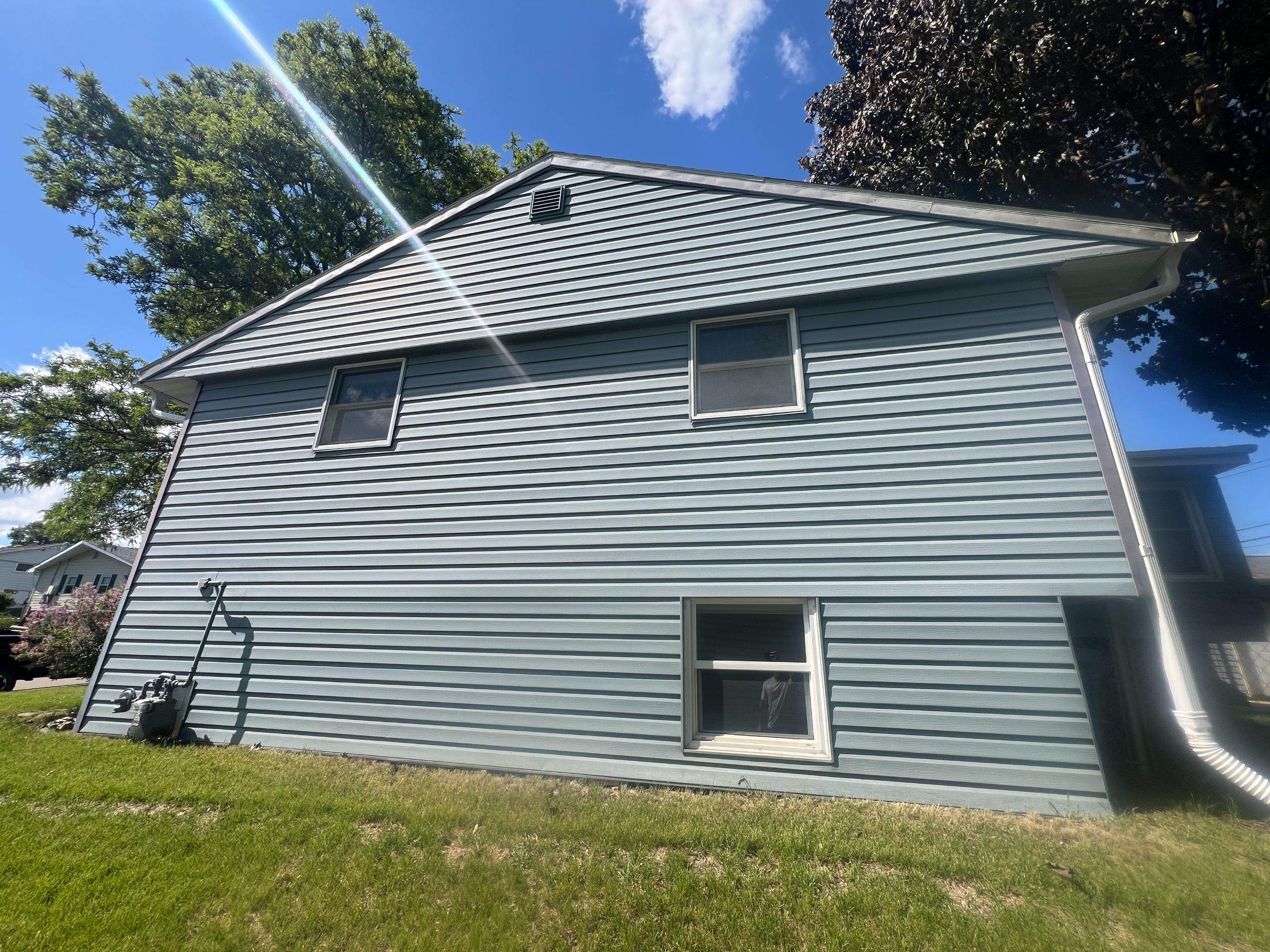 Fading & Oxidized siding turned new again! by Grandview Painting