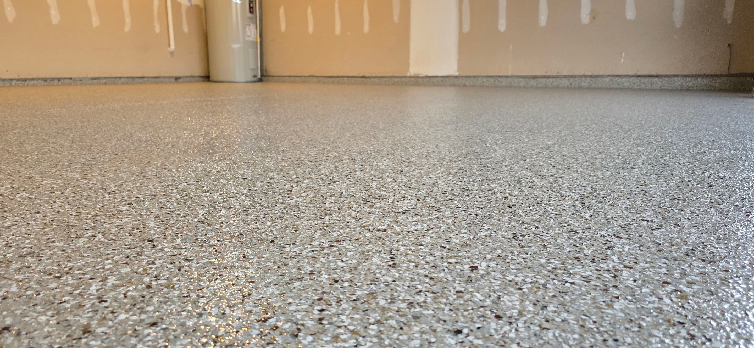 Driveway, Garage, & Front Porch using Creekbed by Elite Floor Solutions