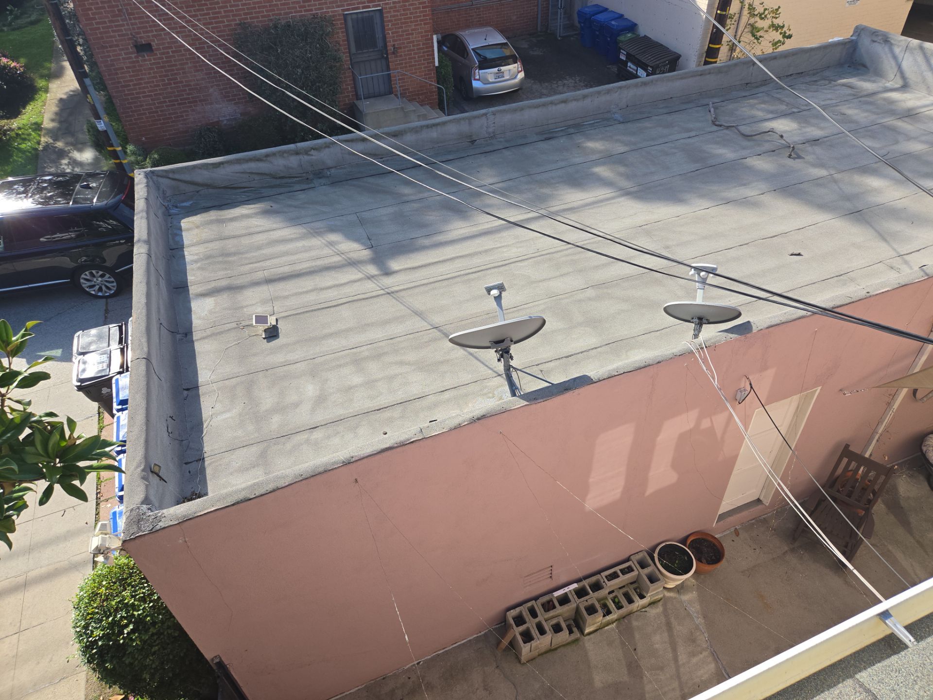 Apartment Building 2nd Layer Installation &Silicone coating by Hull Brothers Roofing