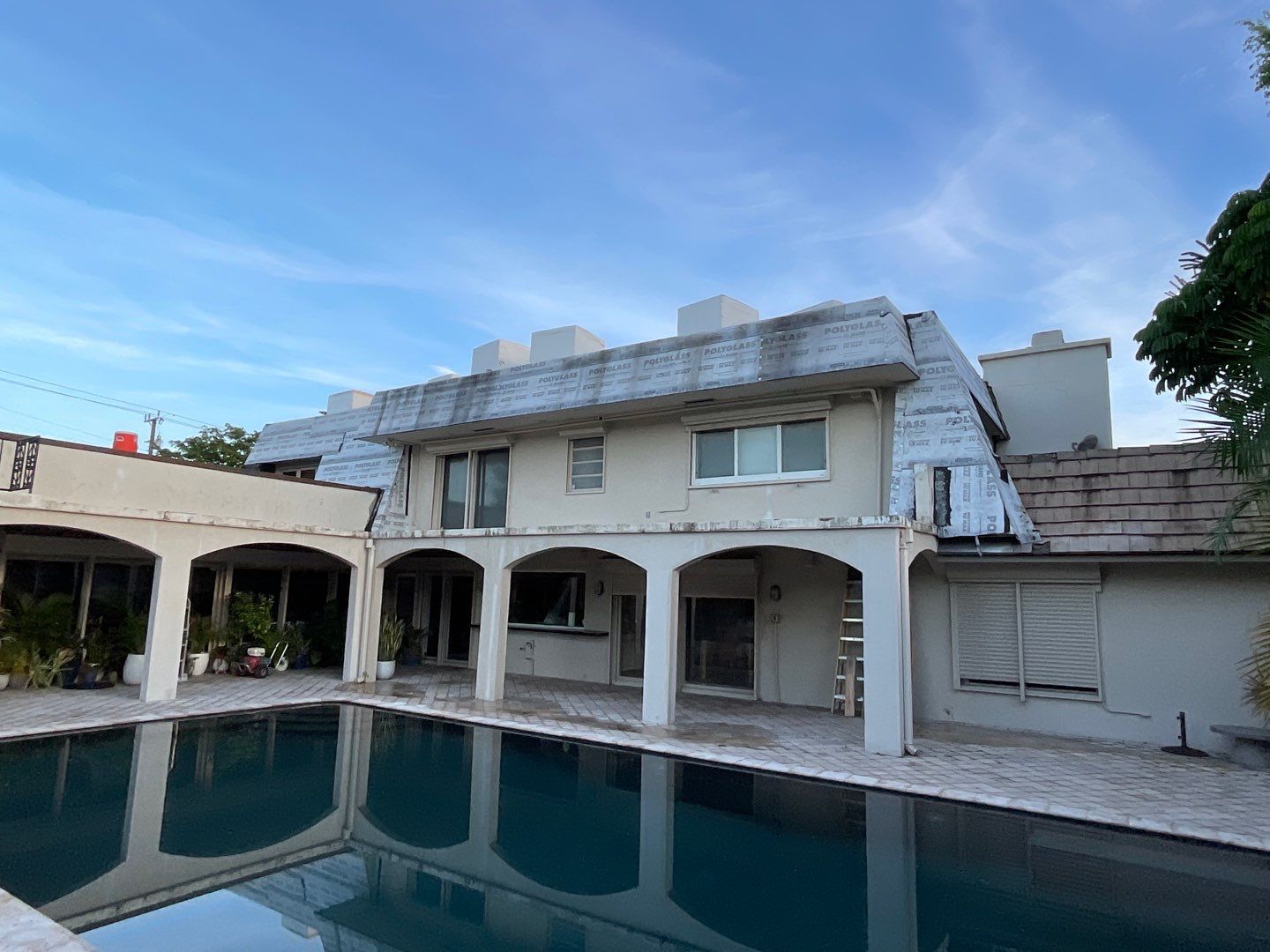 Amazing TPO flat deck re-roof with Eagle mansard in Hollywood Florida.  by First Due Roofing
