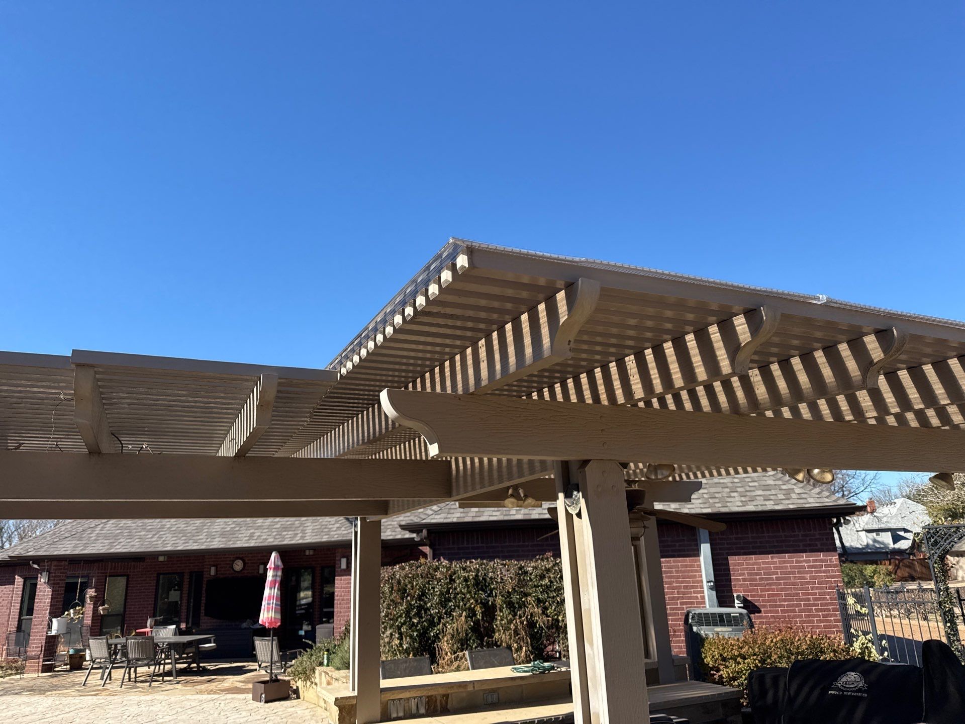 Polygal twin wall roofing system using 8mm bronze twin wall polygal by Grizzly Fence And Patio
