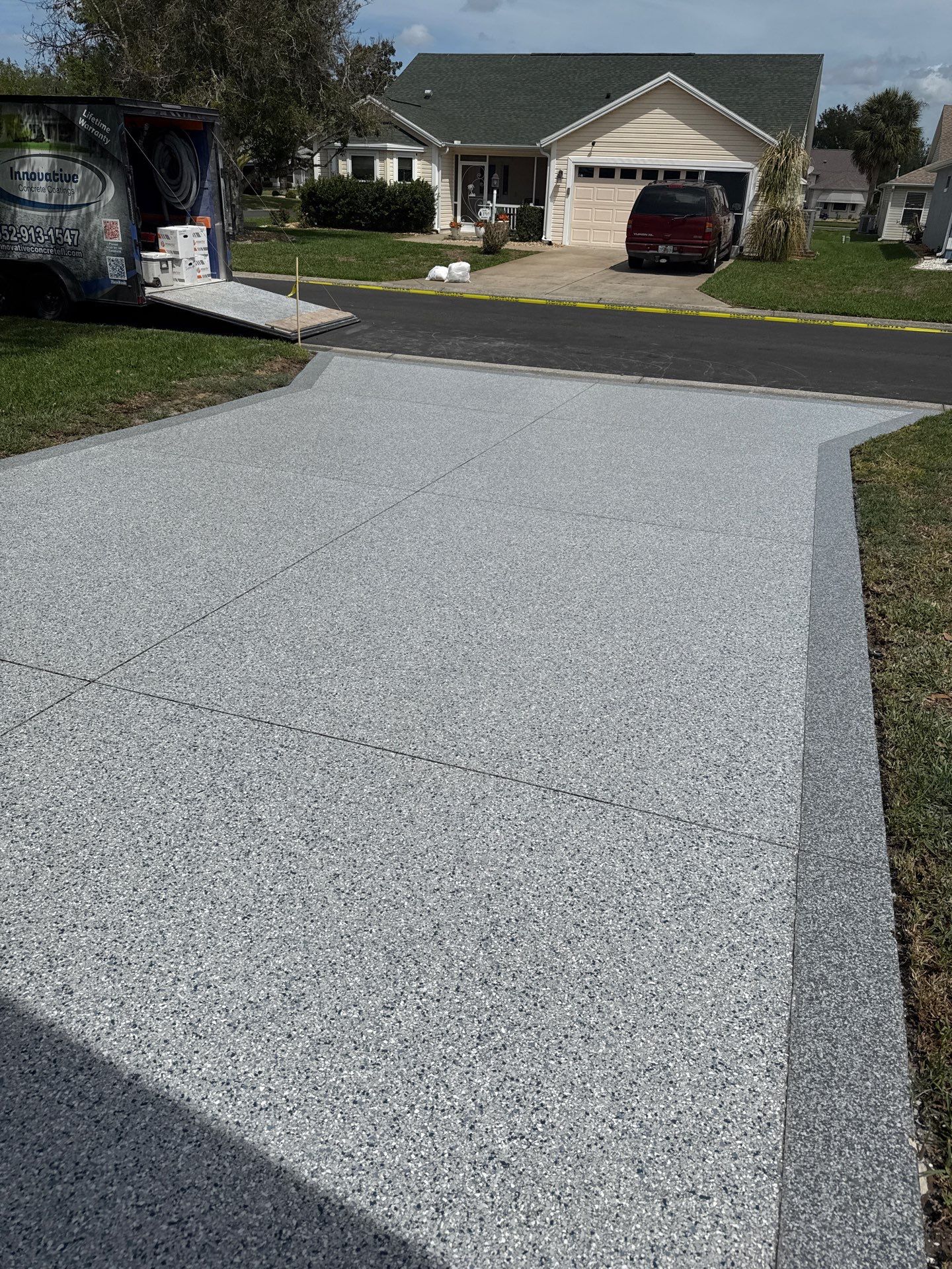 Driveway Tidal Wave with Cool Breeze Border and Sidewalk by Innovative Concrete Coatings 