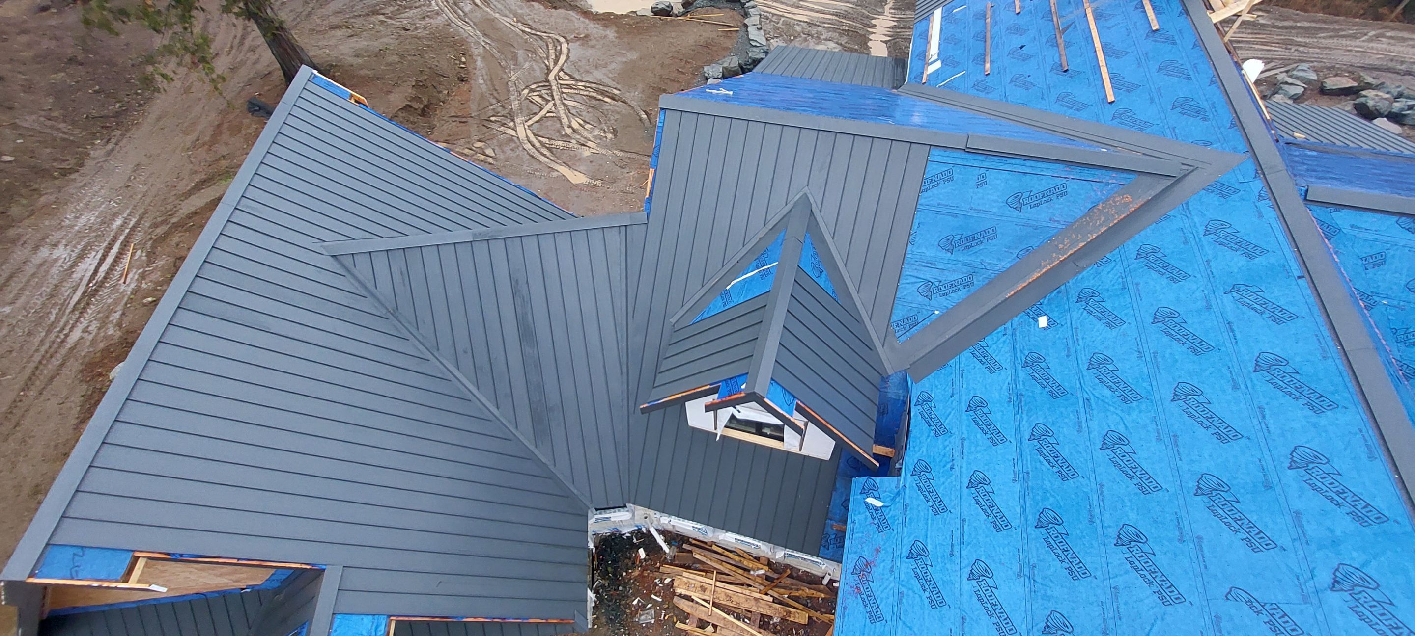 Residential Roofing Installation using 12" Prolok metal by Top Notch Roofing Inc