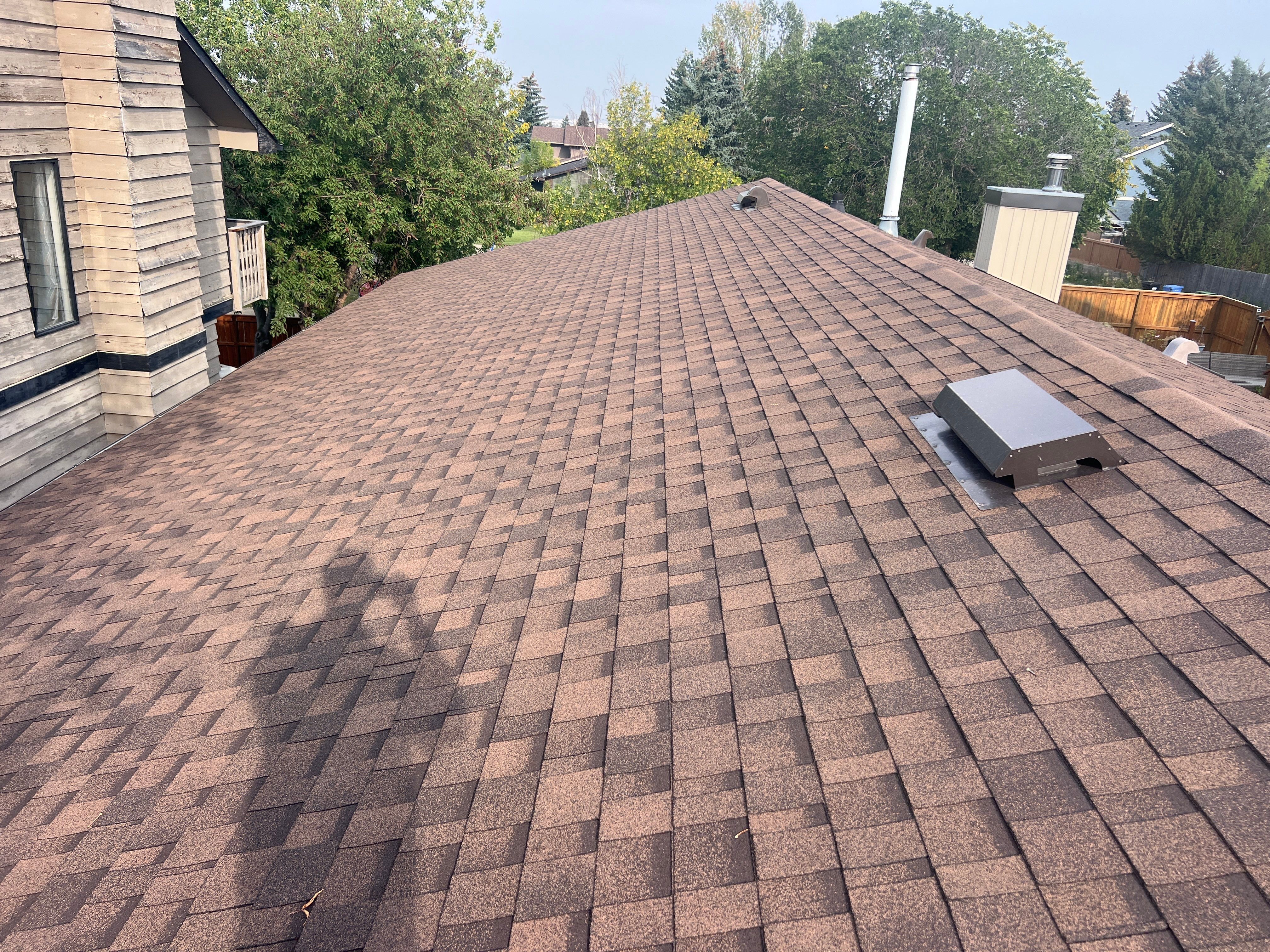 Calgary Chimney Chase Reconstruction and Exterior Siding Replacement by Smart Home Building Systems Ltd.