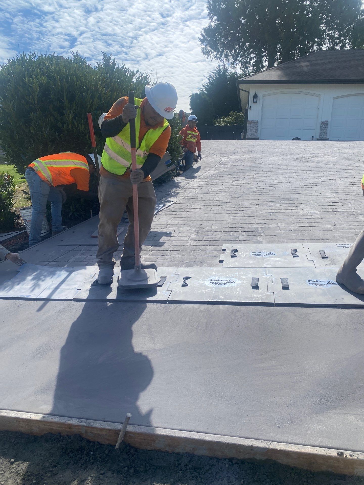 John | Stamped Concrete Driveway Makeover by Jireh Asphalt & Concrete Inc 