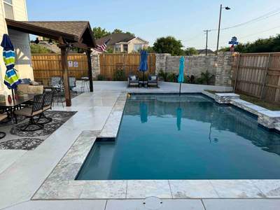 Geometric Pool with Raised Stone Accent Wall