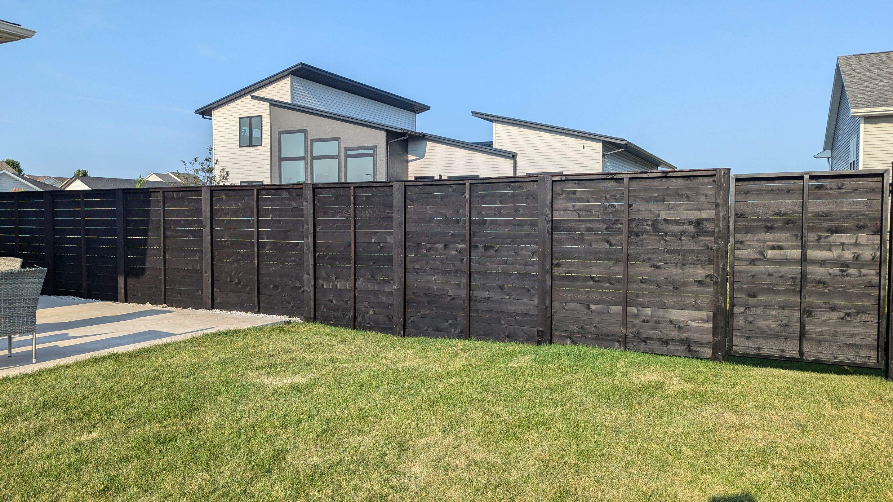Modern Black Stained Horizontal Privacy Fence Installation in Cedar by Perfect Picket Fence and Stain