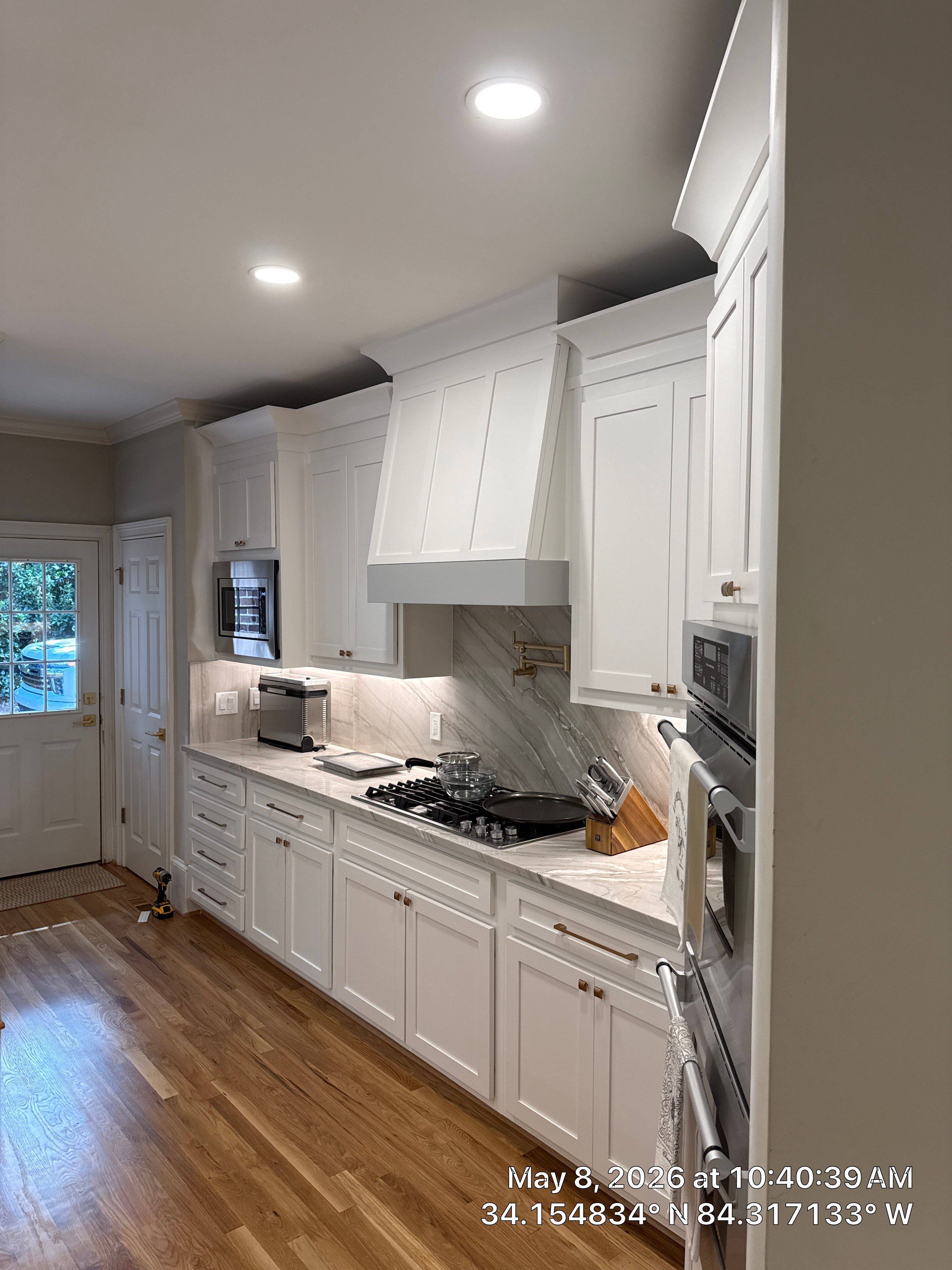 Alpharetta Kitchen Remodel Featuring Double Islands and White Quartz by Heart & Home Kitchen & Bath Remodeling LLC
