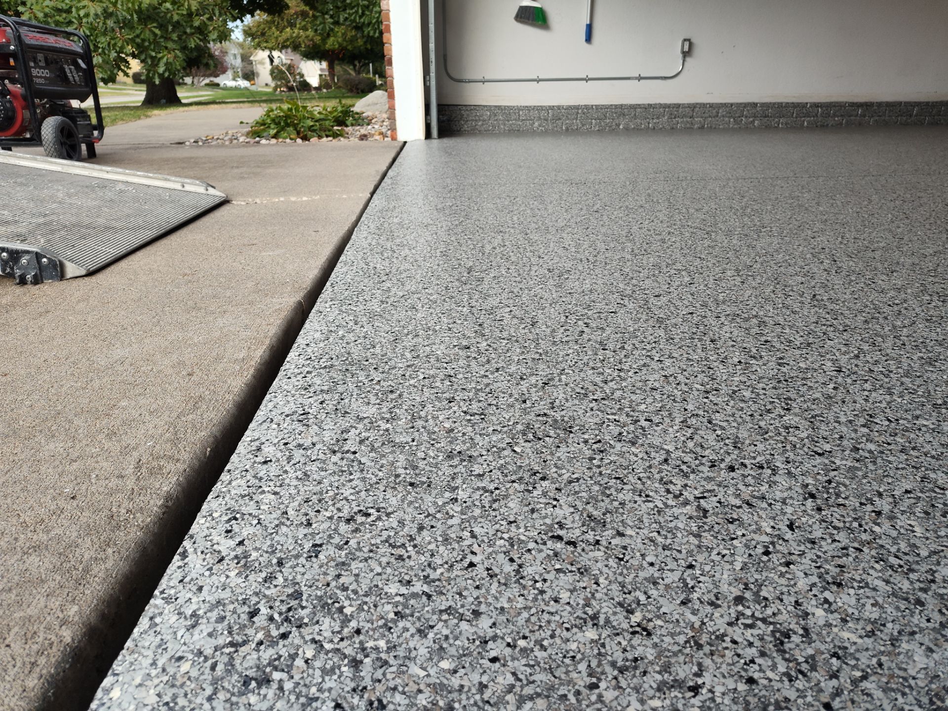 A Garage In One Day Keeps the Rock Salt Away! by Revival Concrete Coatings