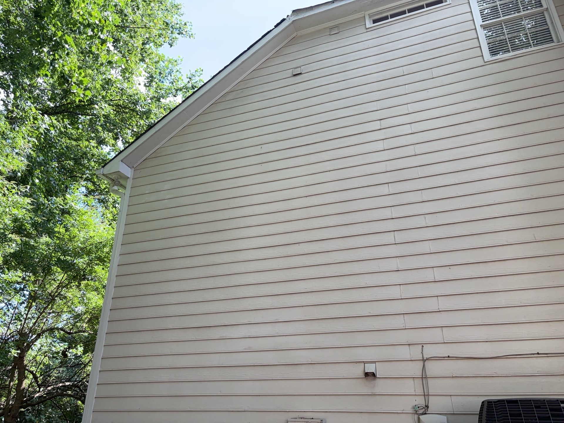 Blue Exterior Paint and Siding Installation using James Hardie Lap Siding by Nelson Exteriors