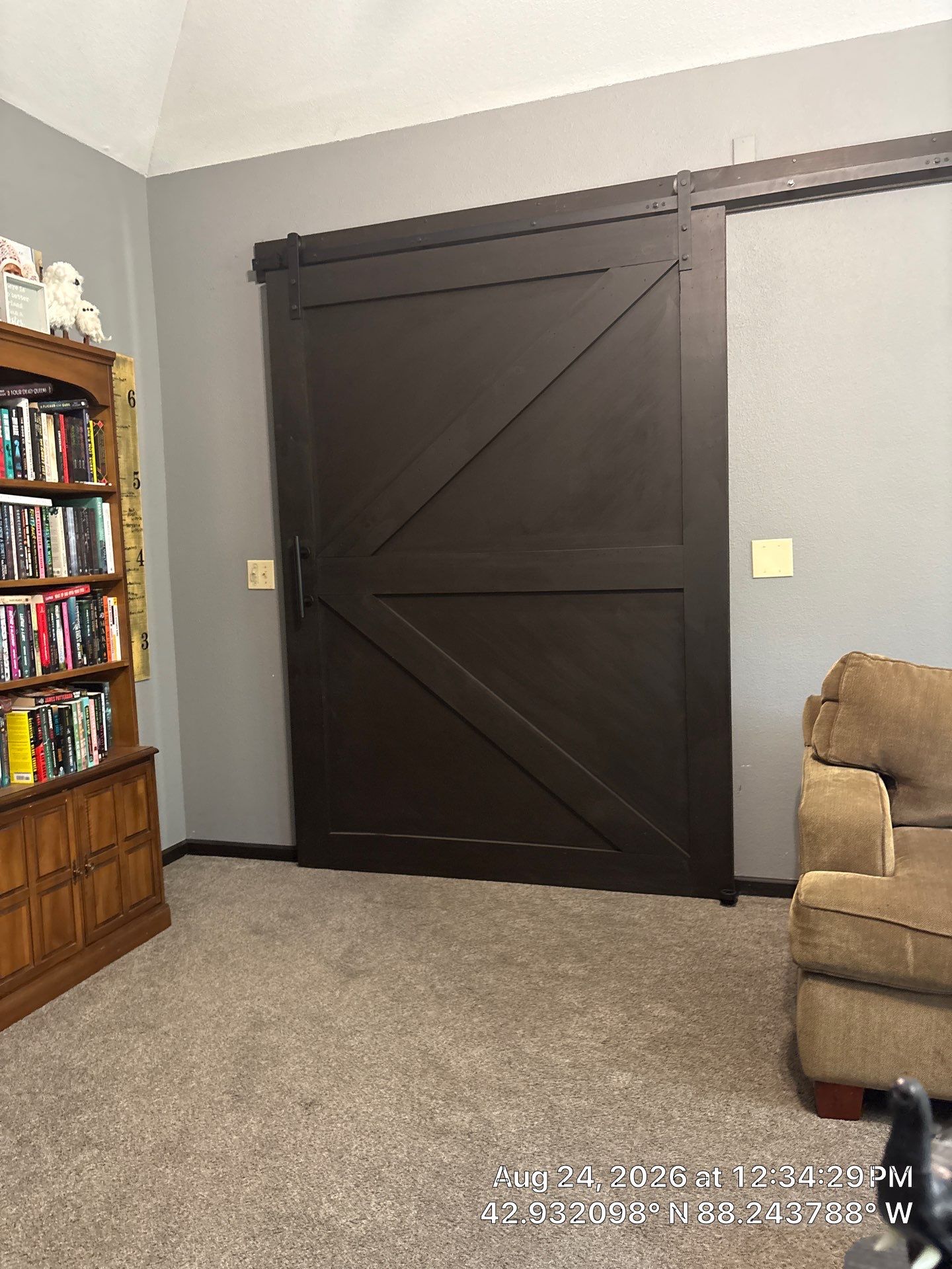 Dark Stained Sliding Barn Door Installation in Waukesha by CompanyCam Sales Demo