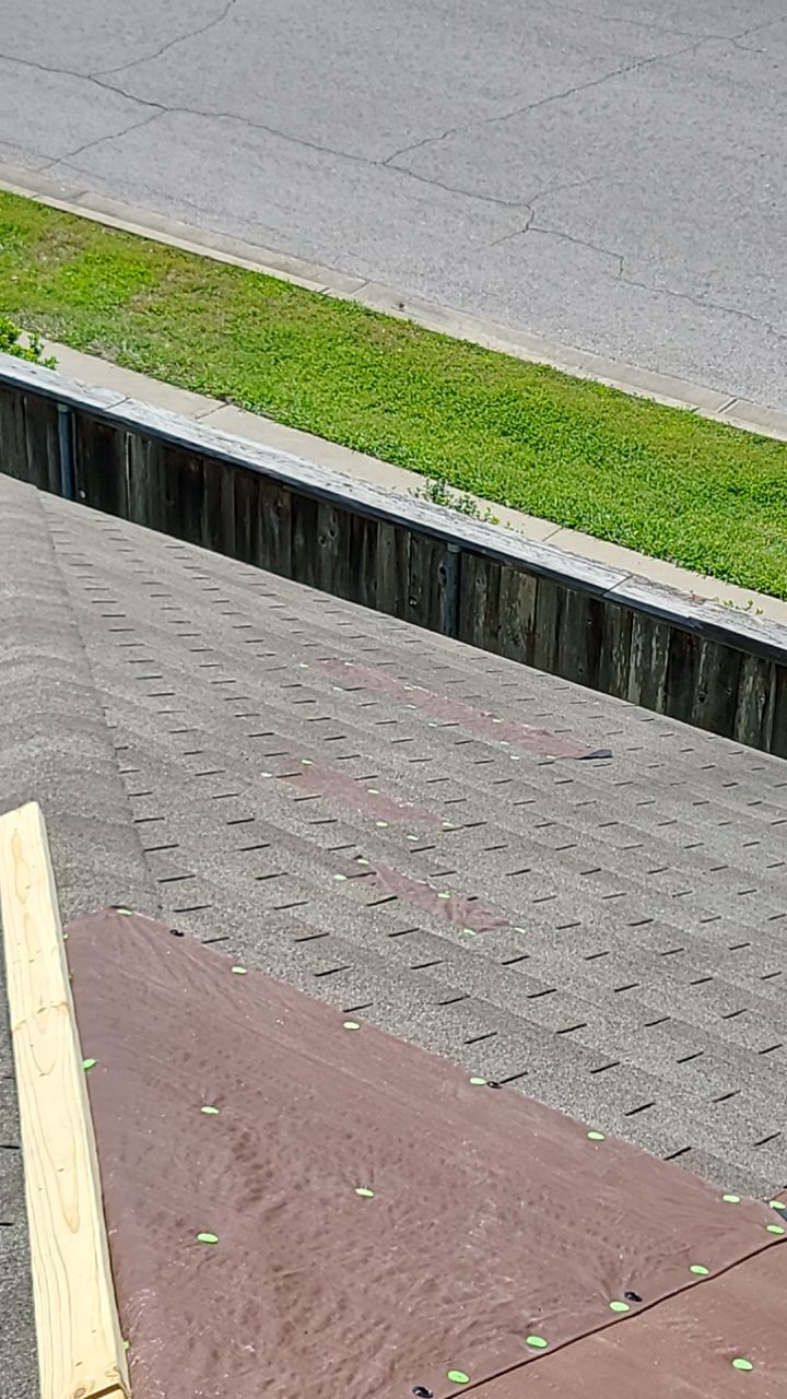 Asphalt Shingle Roof Replacement and Wind Damage Restoration in Manor by Caliber Restoration LLC