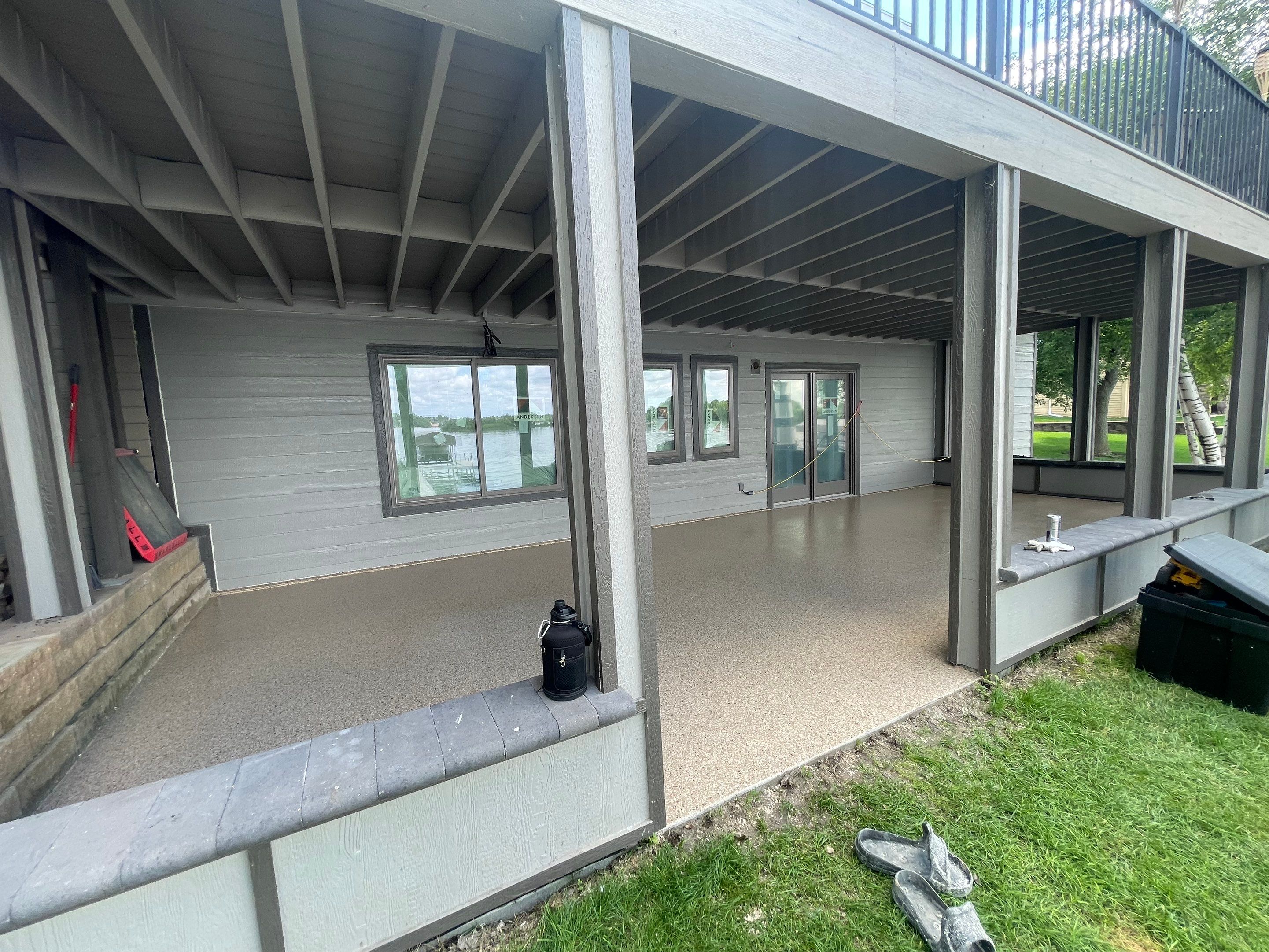 Lakefront Screened Patio Concrete Coating Installation in Wentworth by Select Painting, Coatings & Garage Cabinets
