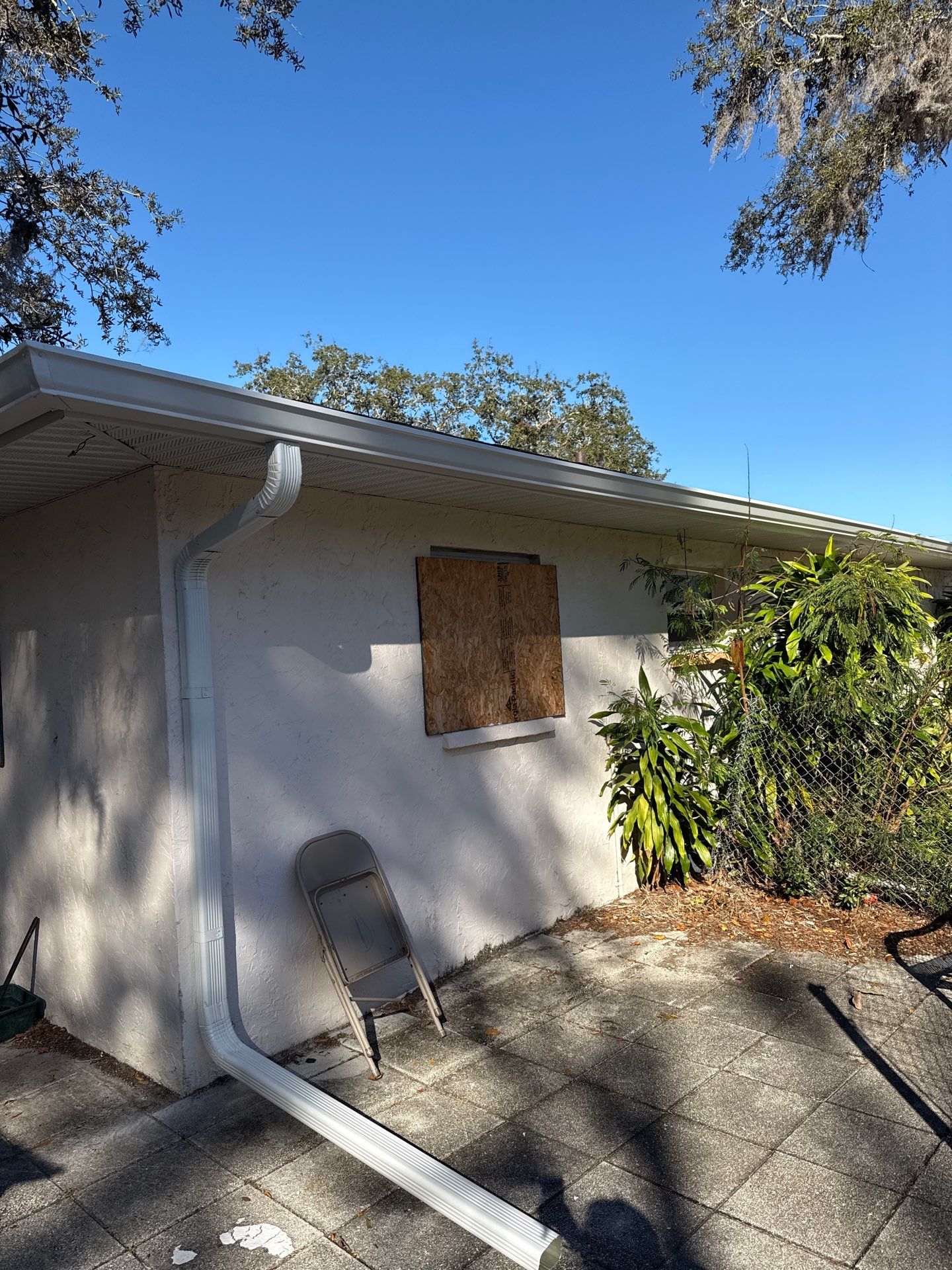 Downspout Installation using White Down Spouts in Sarasota FL by Gutter Professors