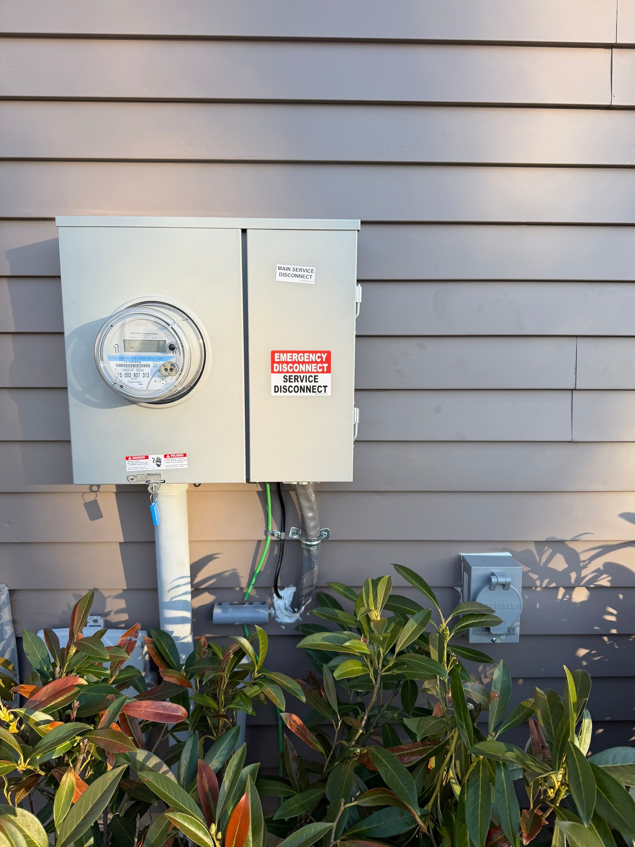 New Panel, GM EV Charger, Meter Disconnect & Generator Inlet by Spartan Home Pros