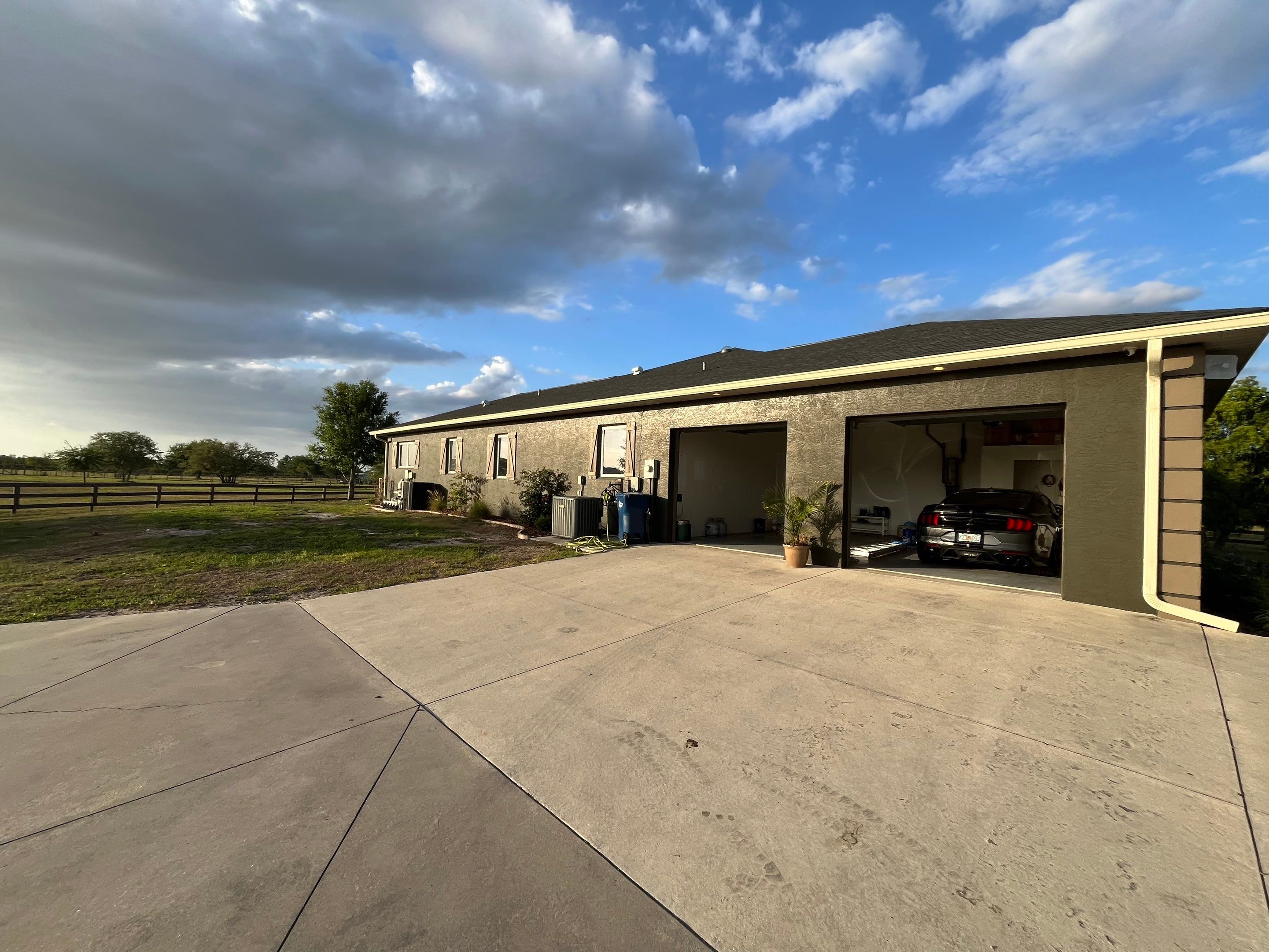  7-inch White seamless gutters and downspouts in Myakka City FL by Gutter Professors