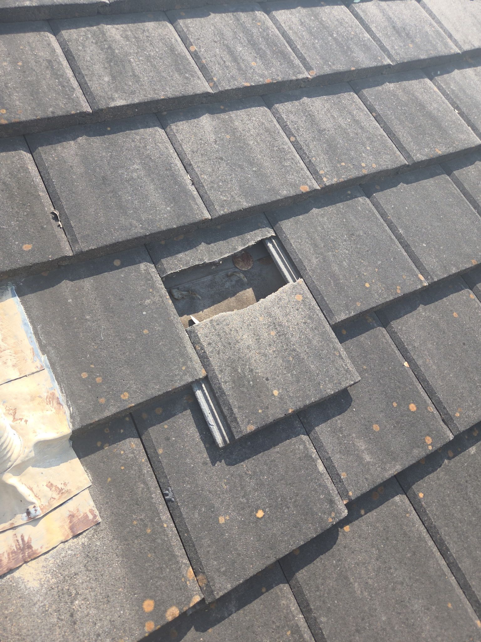 Tile roof and custom chimney cap by REPS Austin Area Roofer
