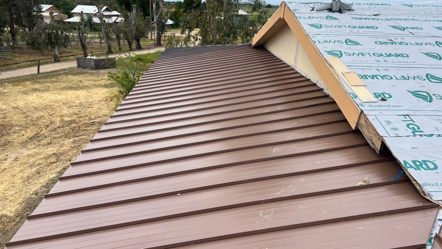 Metal roofing installation using Standing seam metal roofing system by Straight Edge Roofing Inc