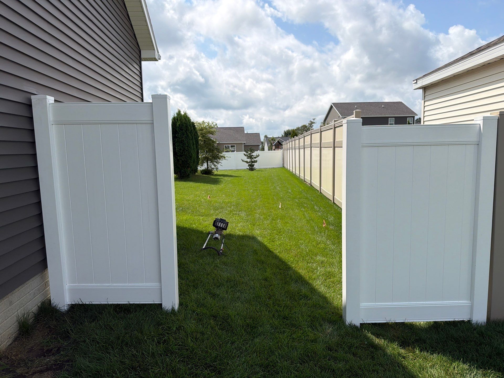 New Vinyl Privacy Fencing and Gates for Waterloo Residential Backyard by Perfect Picket Fence and Stain