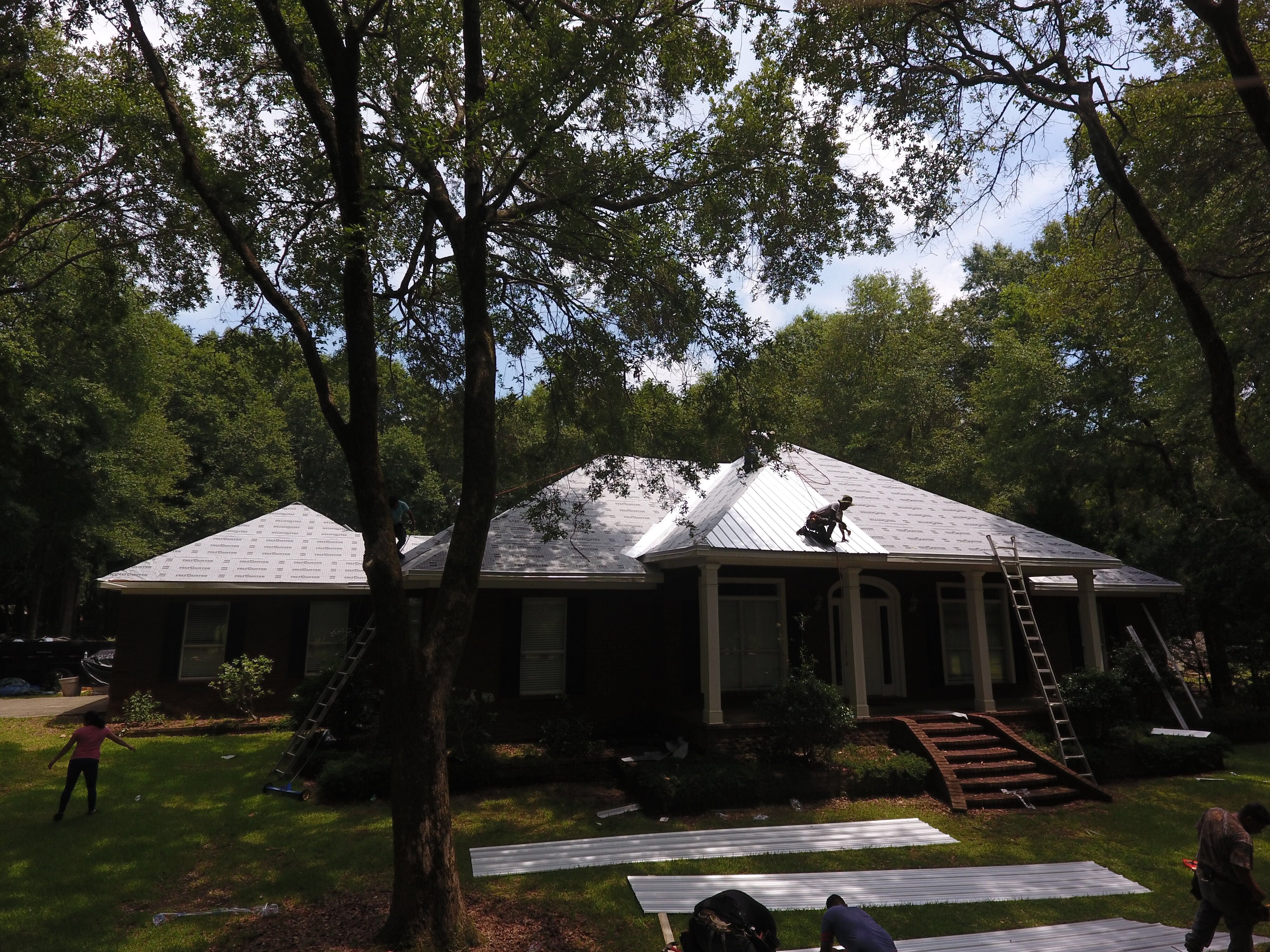 Residential Roofing Installation using Metal roofing by American Roofing & Construction LLC